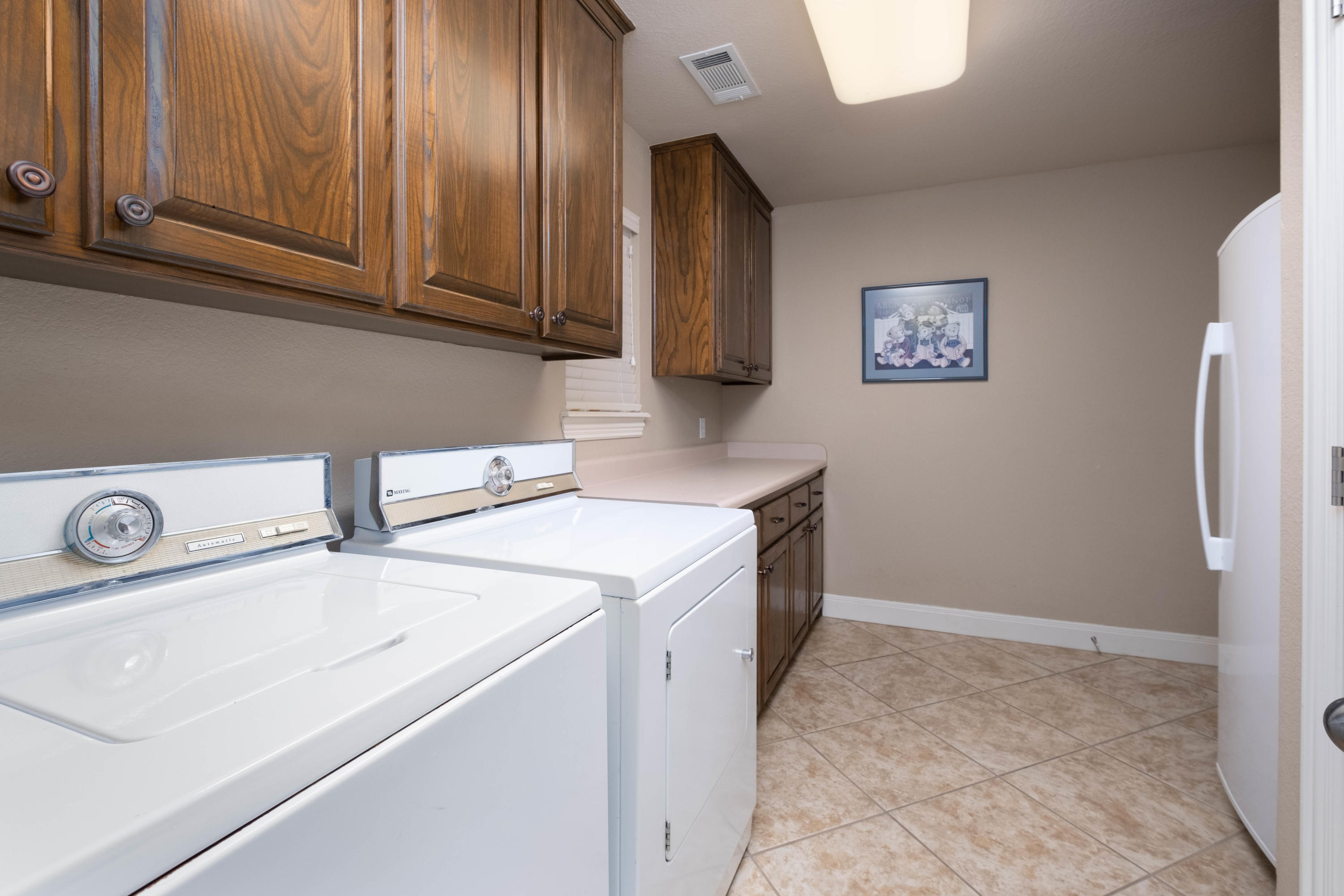 6607 Sumac Place Amarillo, TX 79124 - Photo 28 of 32 a utility room with dryer and washer
