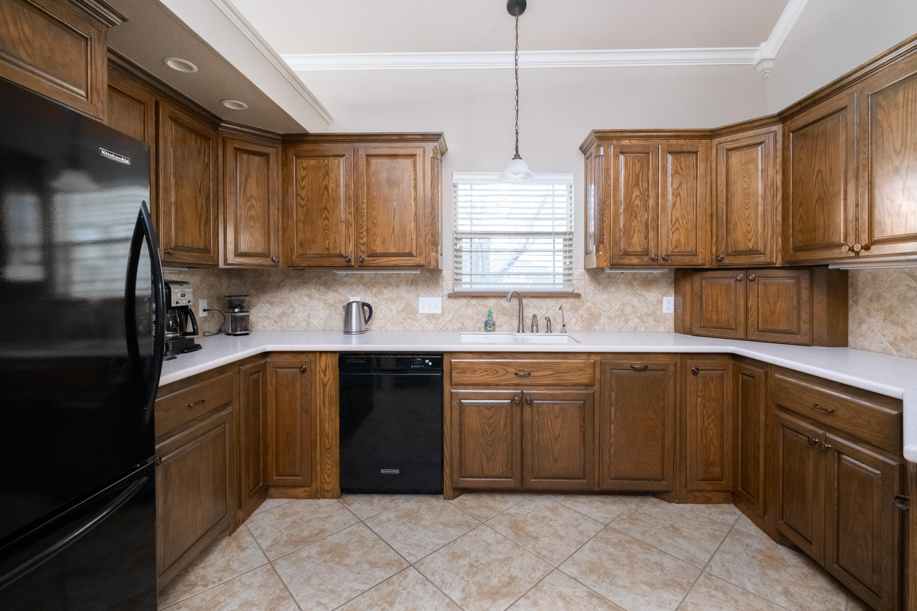 6607 Sumac Place Amarillo, TX 79124 - Photo 8 of 32 a kitchen with stainless steel appliances granite countertop a sink stove and refrigerator