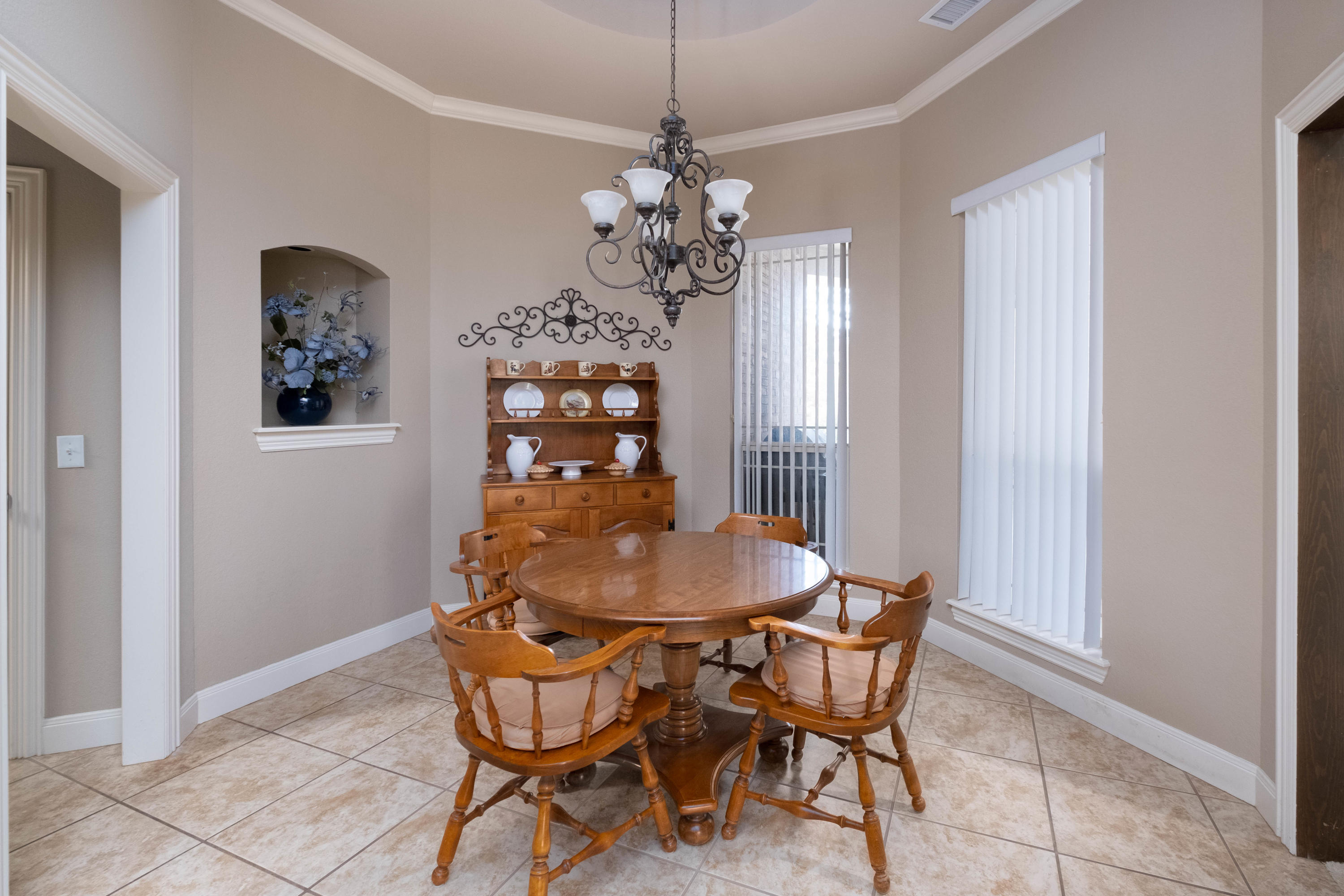 6607 Sumac Place Amarillo, TX 79124 - Photo 9 of 32 a dining room with furniture and window