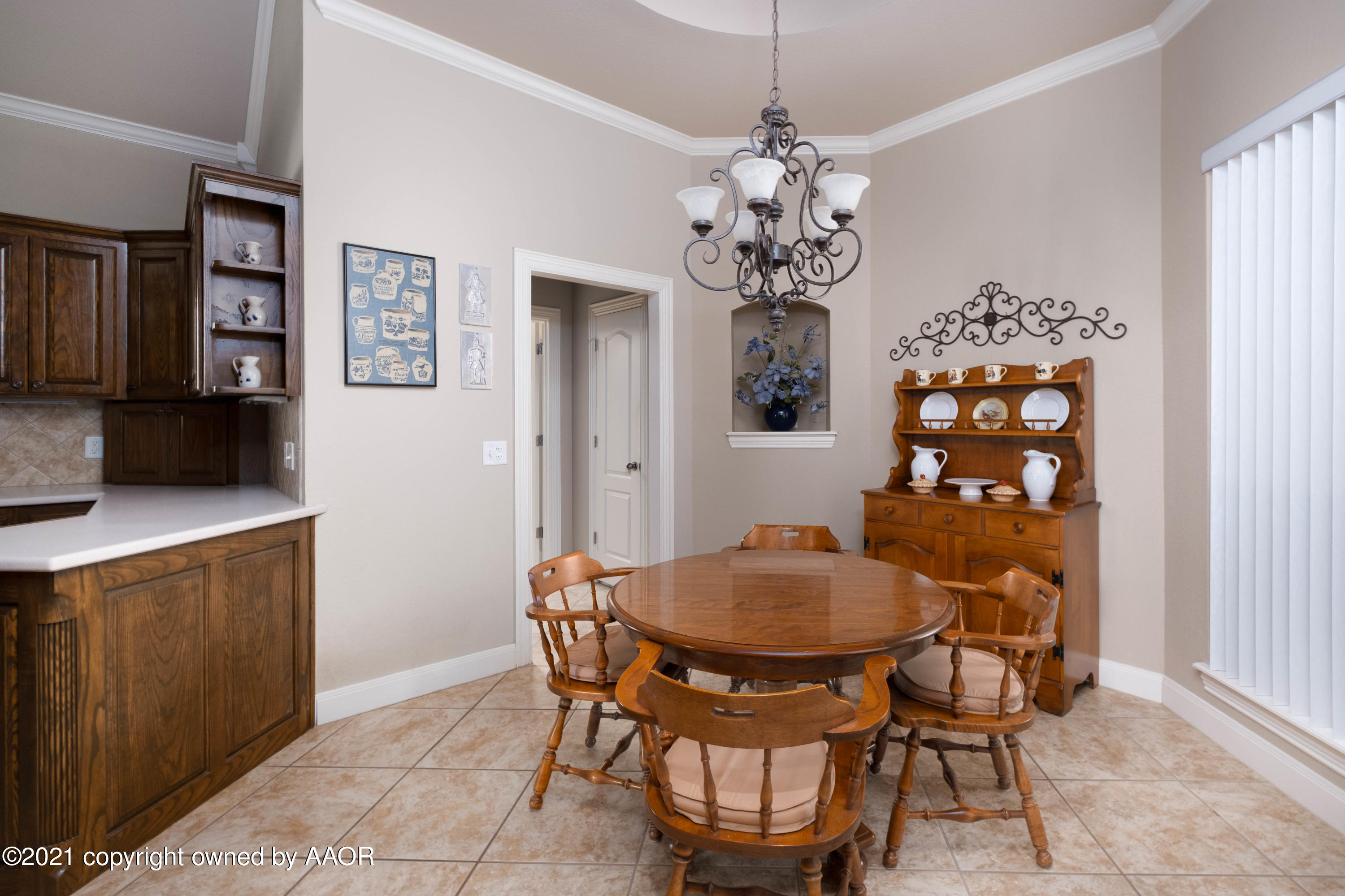 6607 Sumac Place Amarillo, TX 79124 - Photo 10 of 32 a view of a dining room with furniture and chandelier