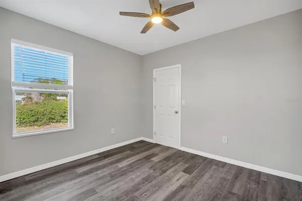 a view of a room with wooden floor