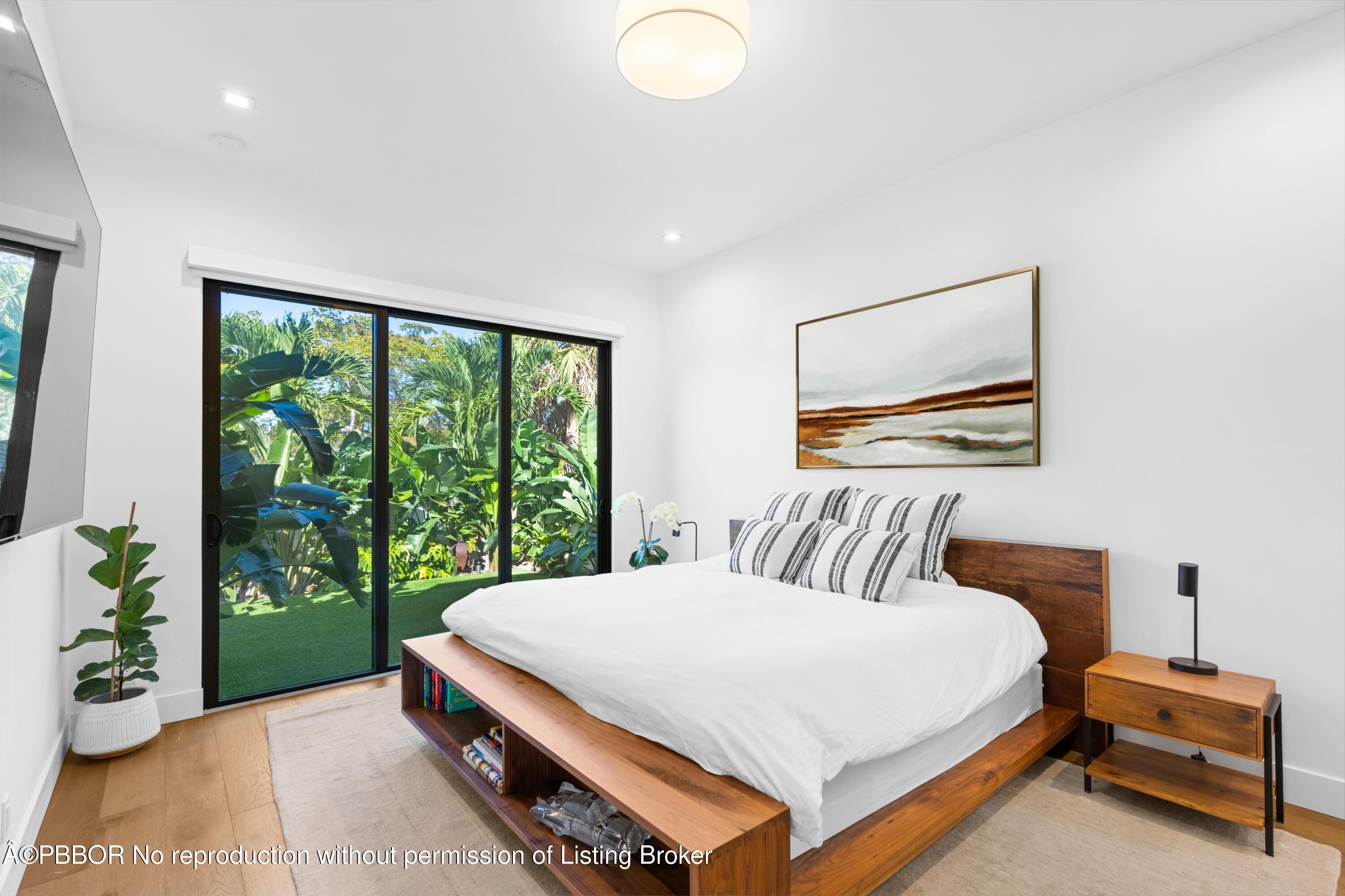230 Seville Road West Palm Beach, FL 33405 - Photo 11 of 25 a bedroom with a bed and a large window