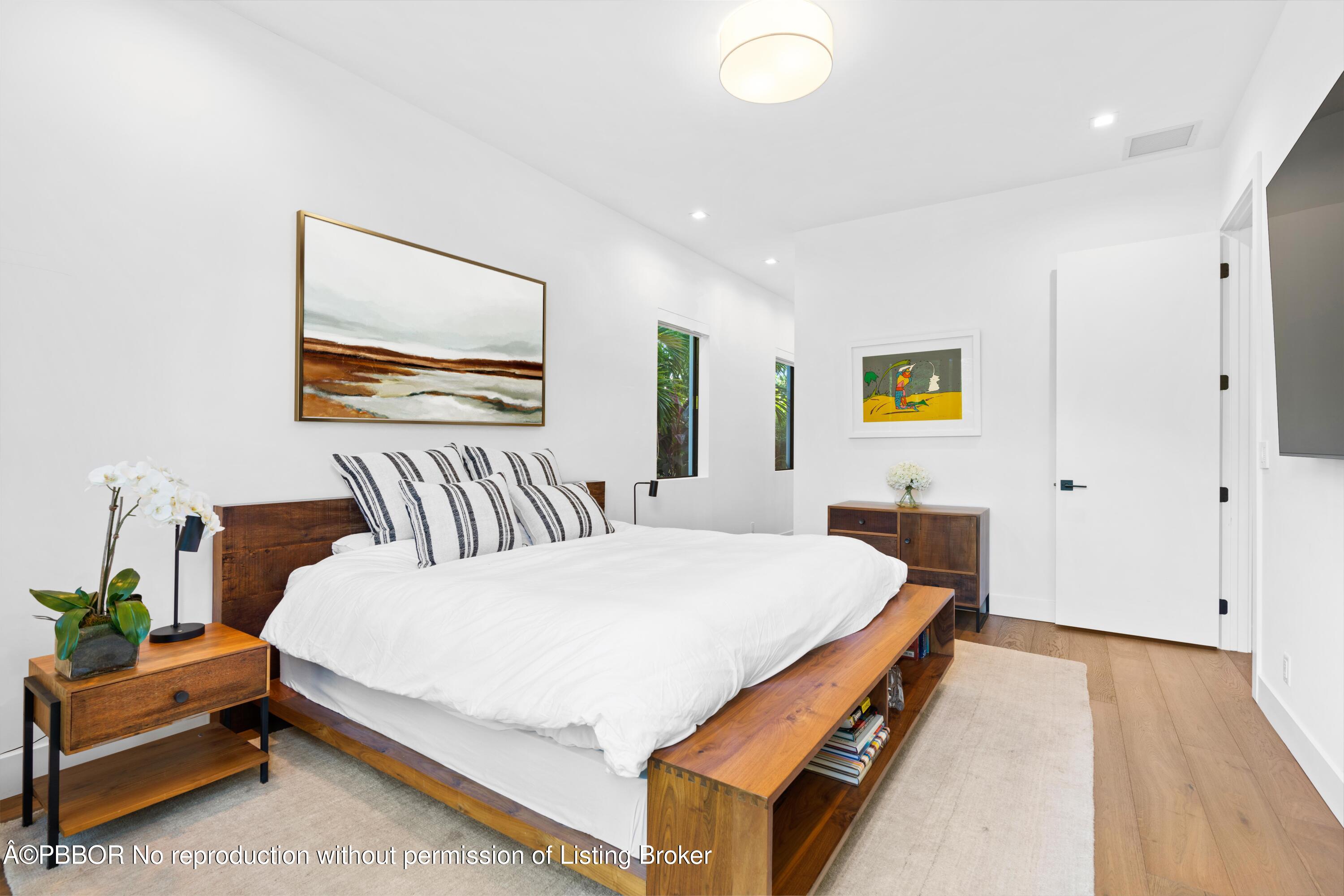 230 Seville Road West Palm Beach, FL 33405 - Photo 13 of 25 a bedroom with a bed and a painting on the wall