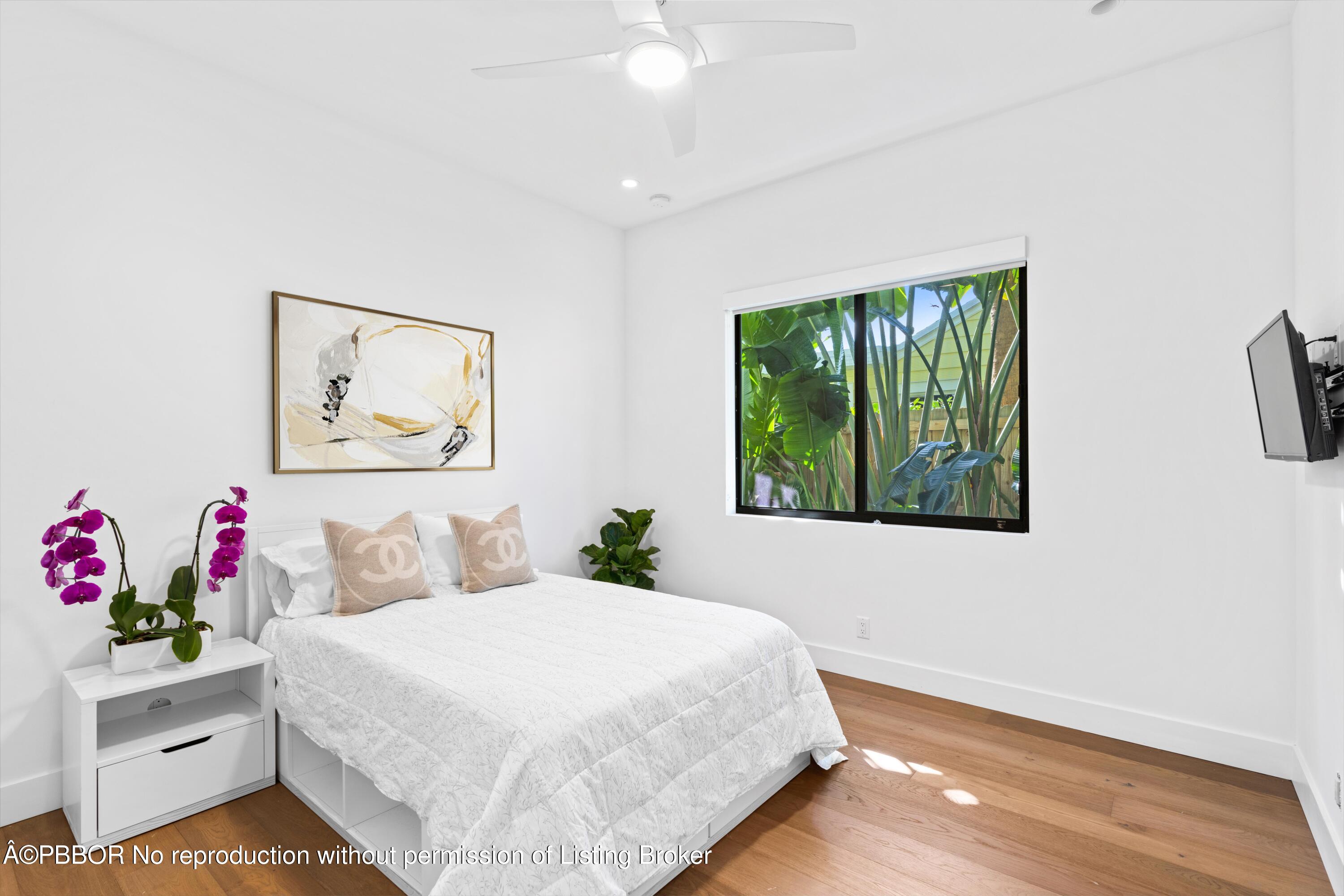 230 Seville Road West Palm Beach, FL 33405 - Photo 16 of 25 a bedroom with a bed and a window