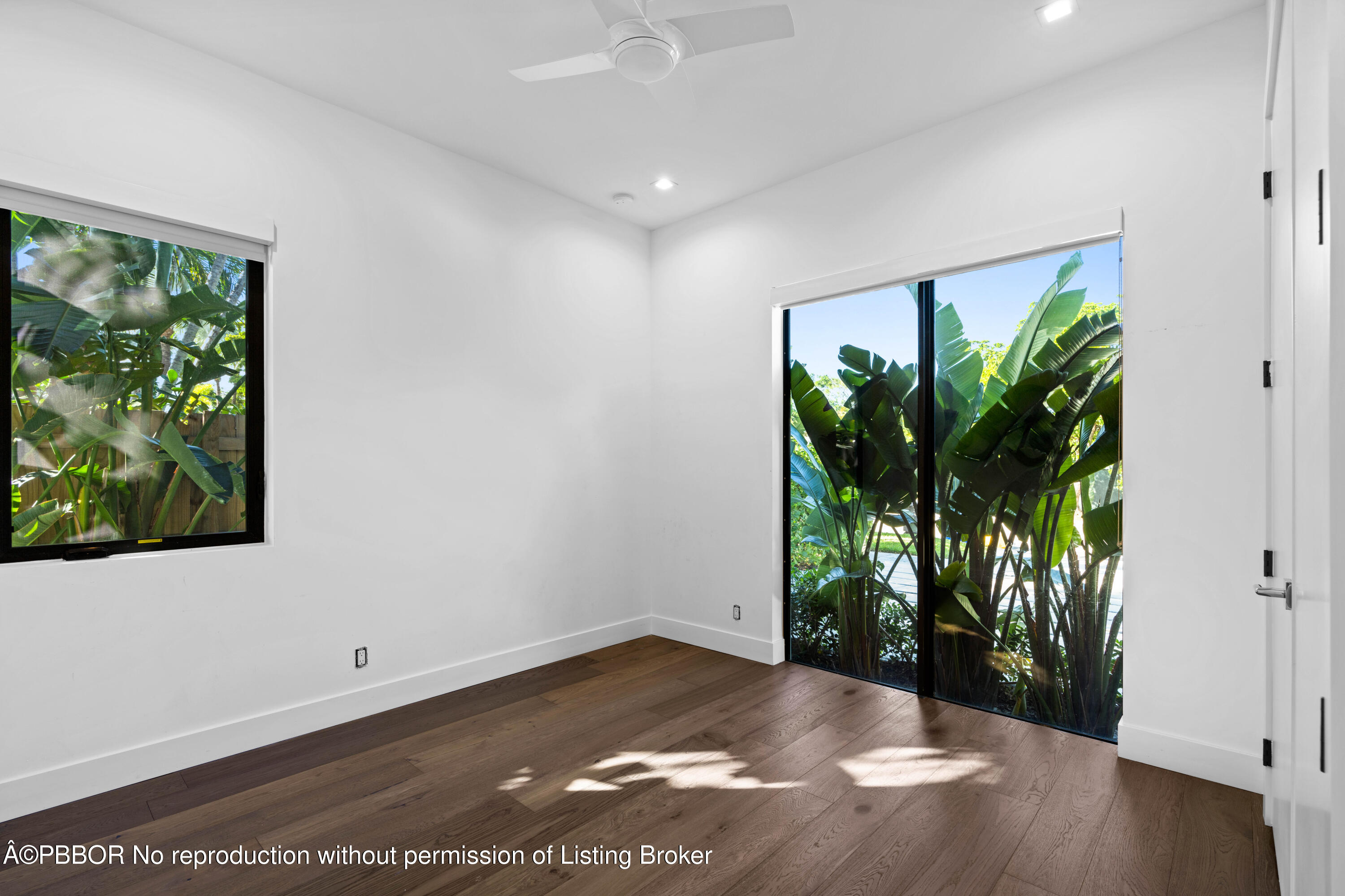 230 Seville Road West Palm Beach, FL 33405 - Photo 18 of 25 a view of a room with floor to ceiling window and wooden floor