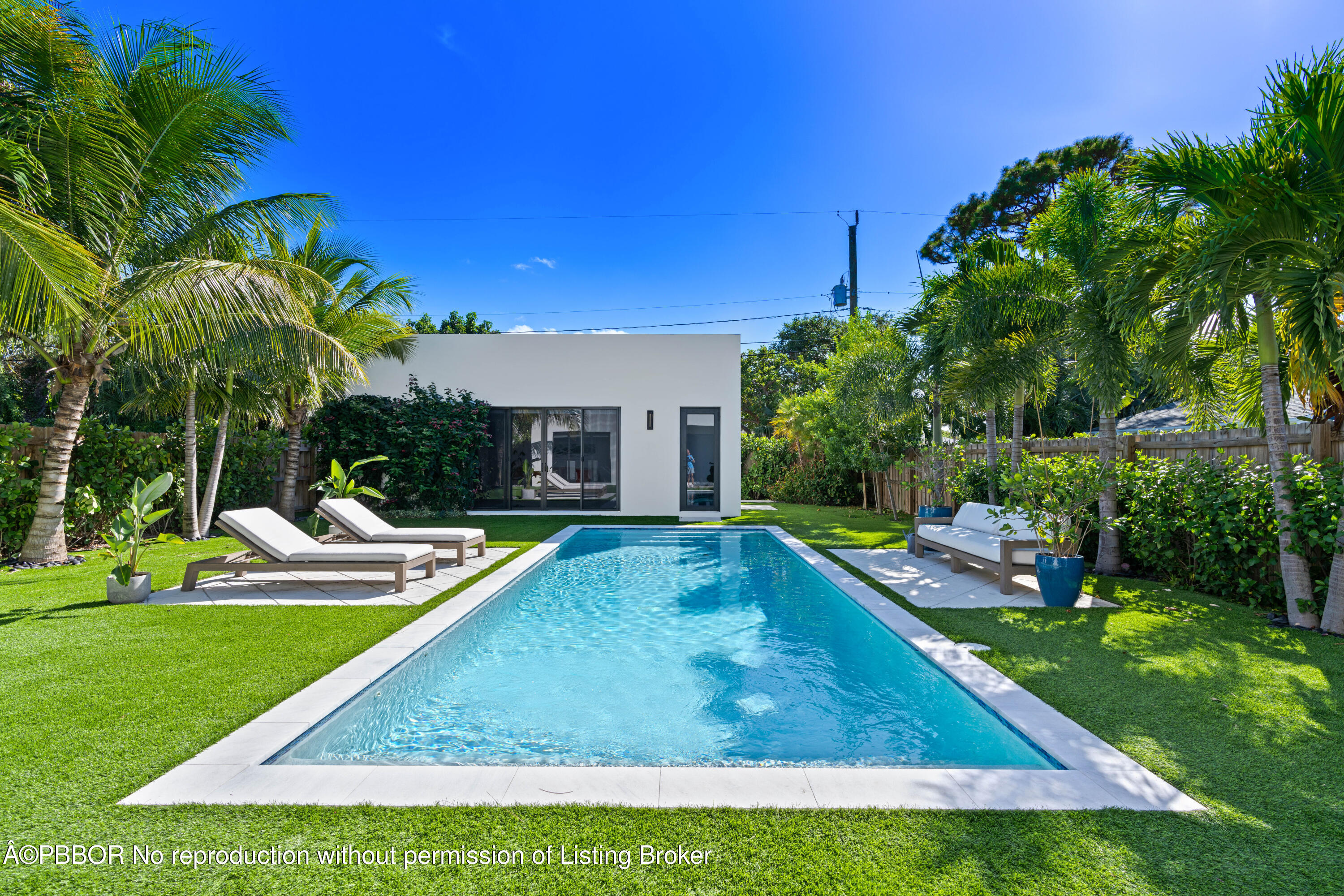 230 Seville Road West Palm Beach, FL 33405 - Photo 20 of 25 a view of a house with swimming pool and sitting area