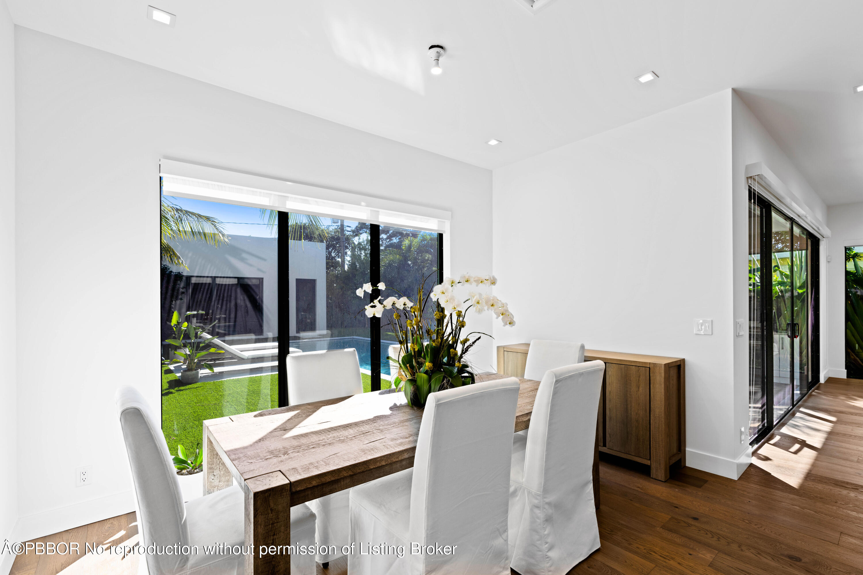 230 Seville Road West Palm Beach, FL 33405 - Photo 4 of 25 a view of a dining room with furniture window and wooden floor