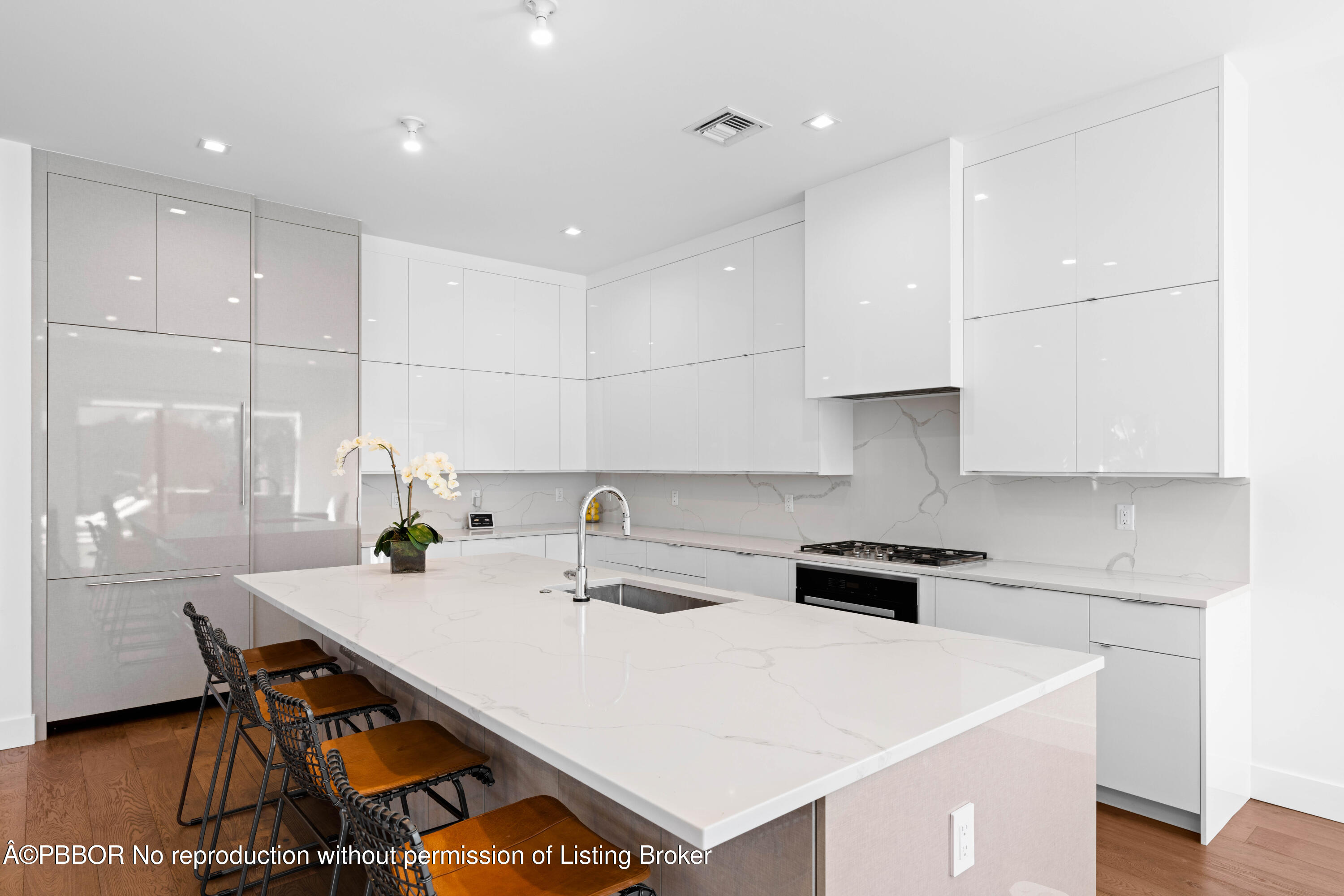 230 Seville Road West Palm Beach, FL 33405 - Photo 5 of 25 a kitchen with a stove a white table and chairs