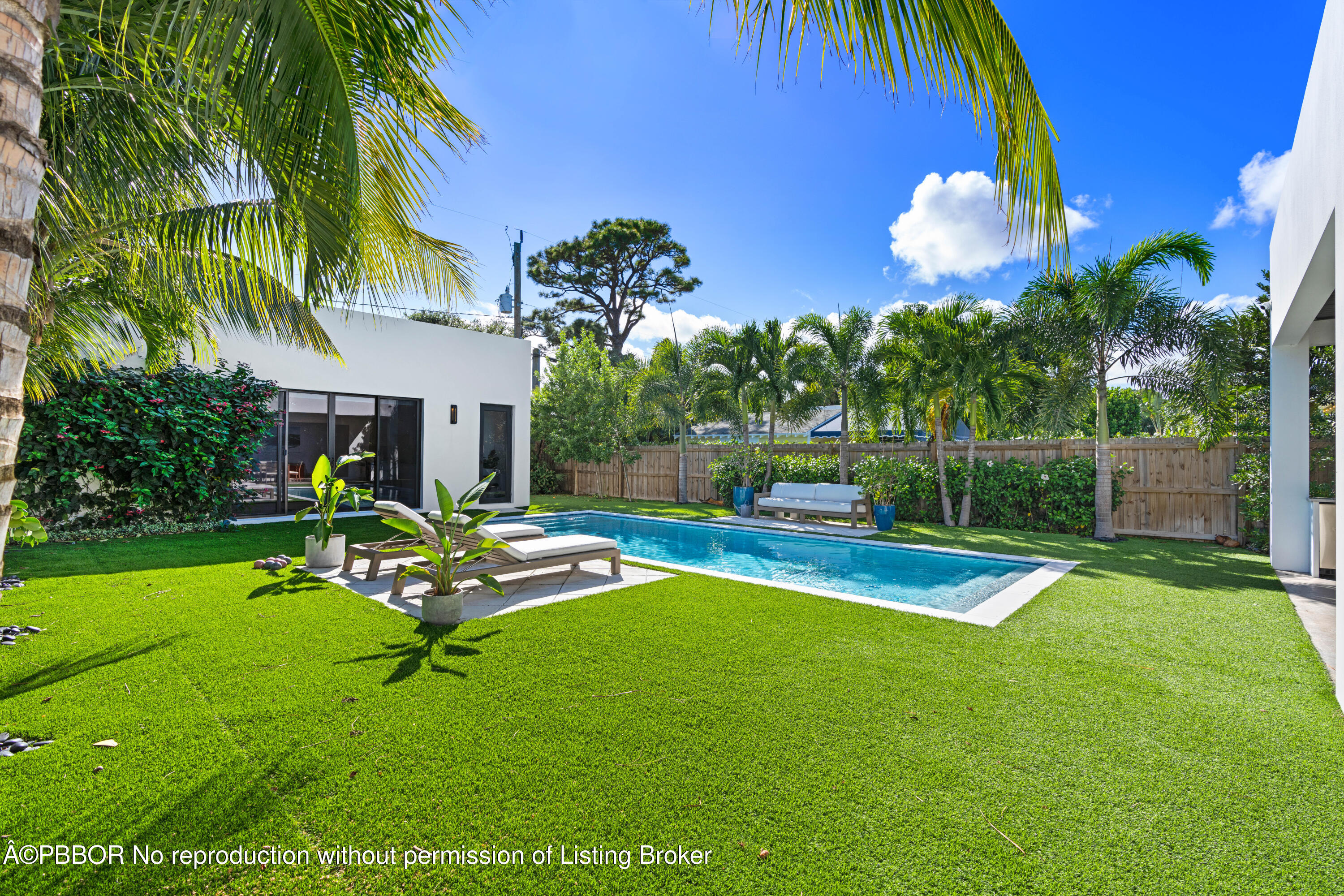 230 Seville Road West Palm Beach, FL 33405 - Photo 9 of 25 a view of a backyard with swimming pool