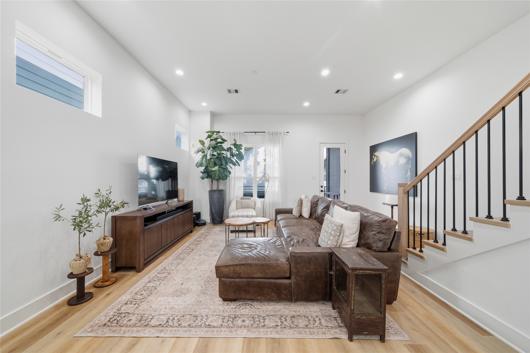 1307 East 27th Street Houston, TX 77009 - Photo 12 of 33 a living room with furniture potted plant and a flat screen tv