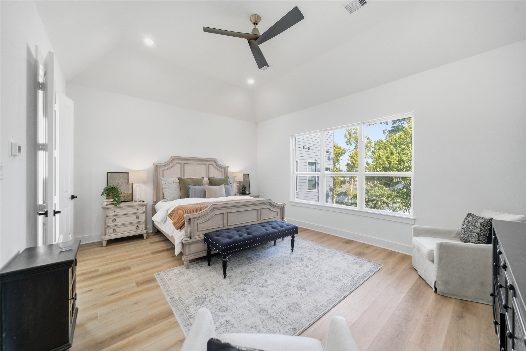1307 East 27th Street Houston, TX 77009 - Photo 15 of 33 a spacious bedroom with a bed a window and walk in closet