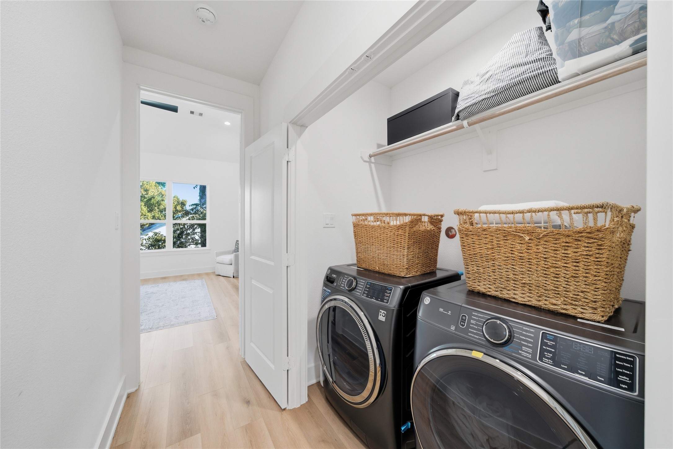 1307 East 27th Street Houston, TX 77009 - Photo 22 of 33 a view of storage and utility room with washer and dryer