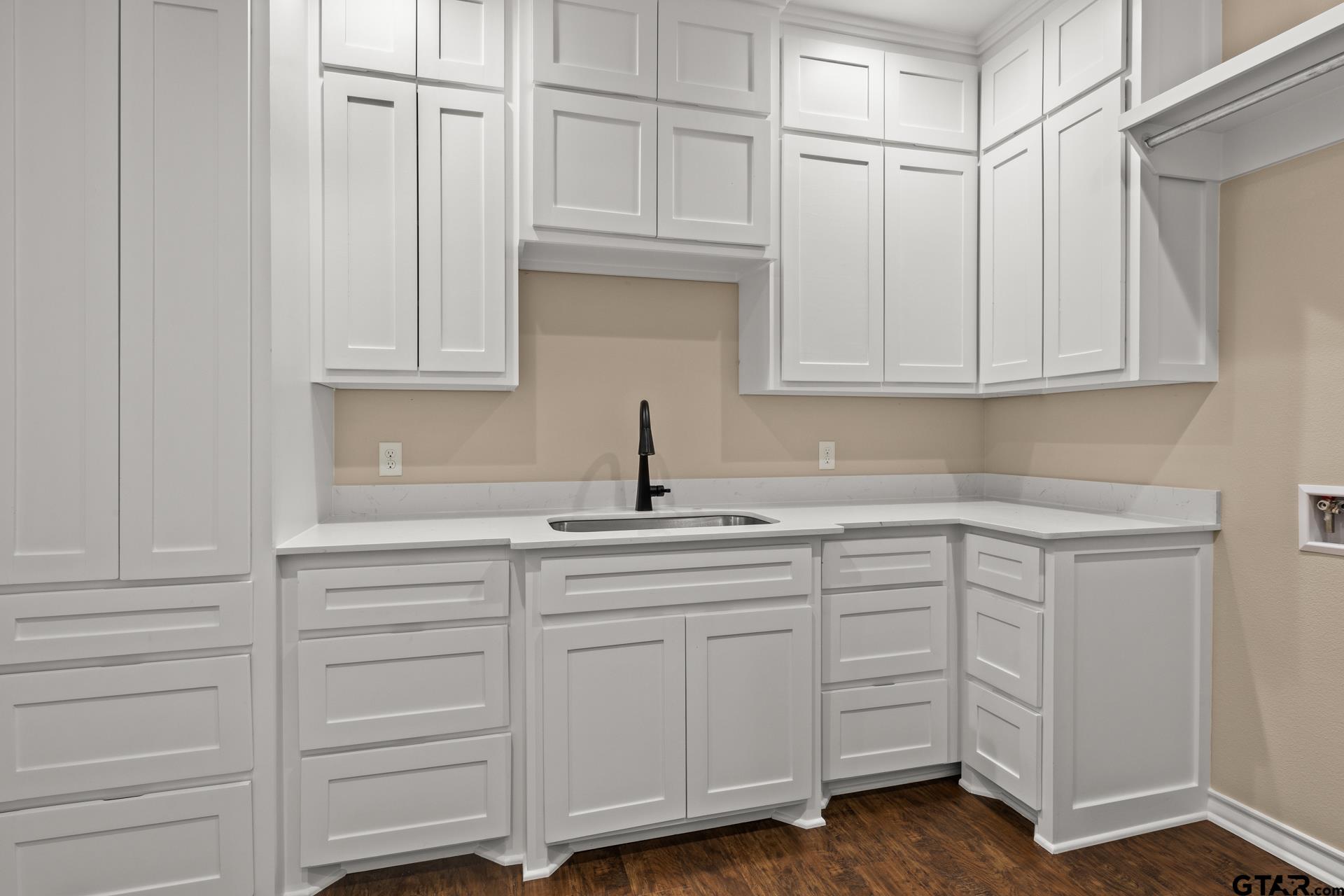 1003 Stone Haven Mount Pleasant, TX 75455 - Photo 30 of 41 a kitchen with white cabinets and sink