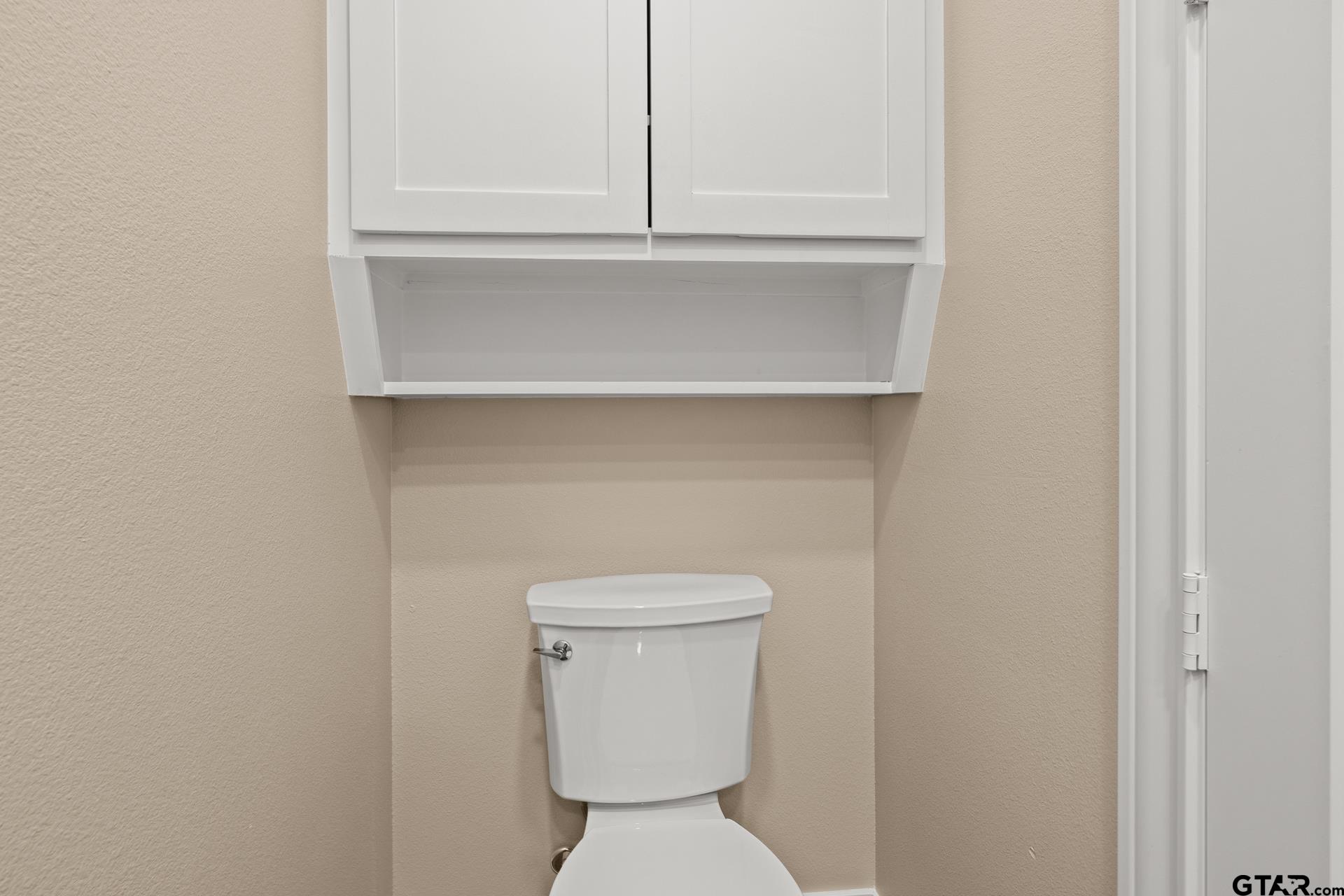 1003 Stone Haven Mount Pleasant, TX 75455 - Photo 33 of 41 a bathroom with a toilet