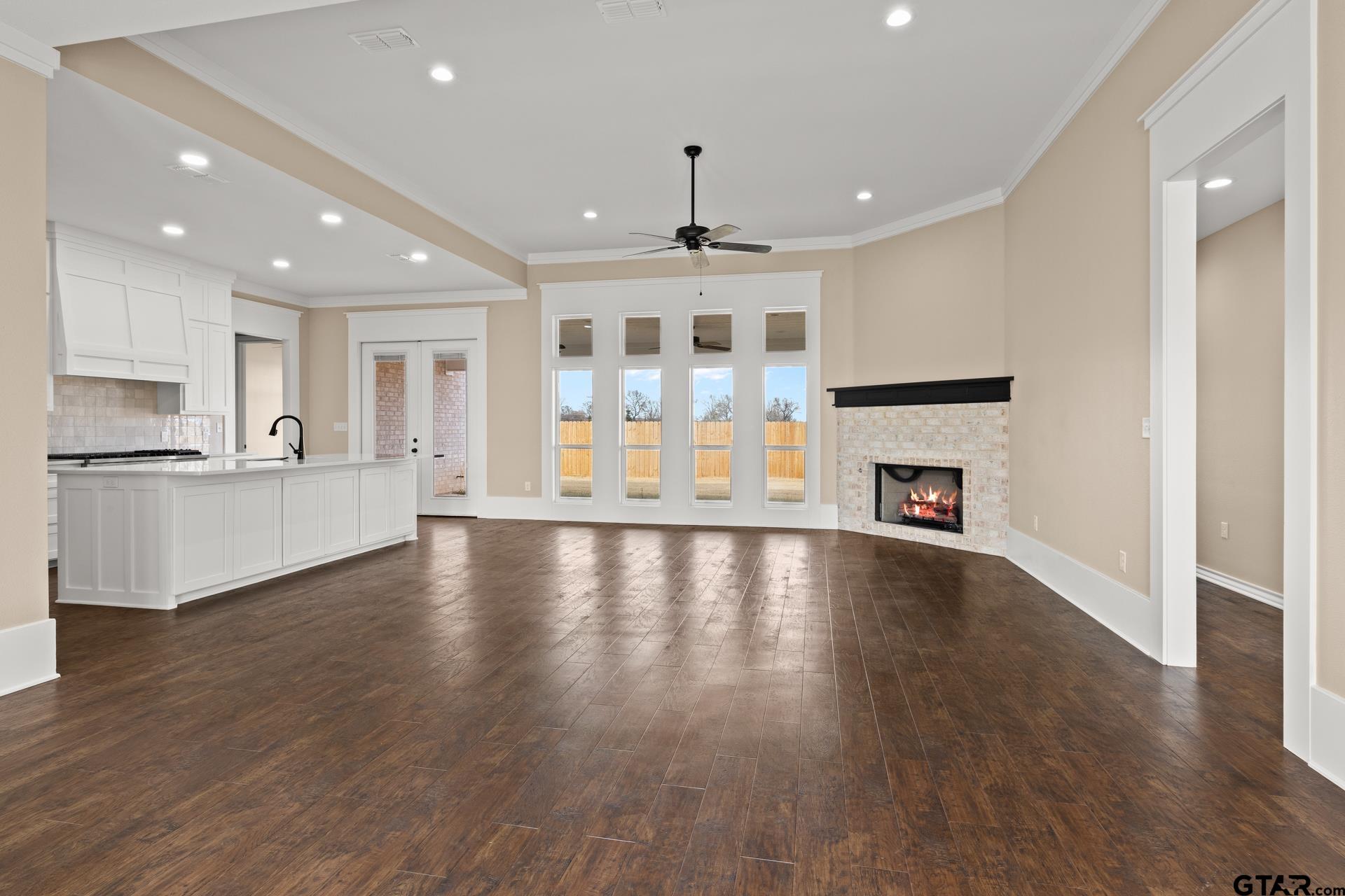 1003 Stone Haven Mount Pleasant, TX 75455 - Photo 4 of 41 a view of an empty room with window and wooden floor