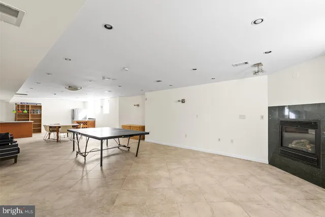 a picture of a bench in front of a wall