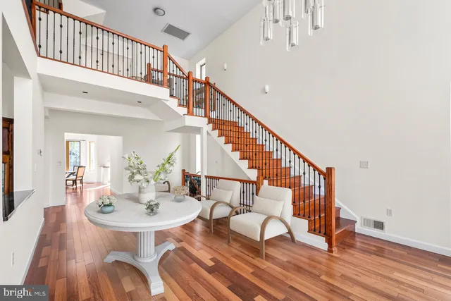 a view of entryway dining room and hall with wooden floor