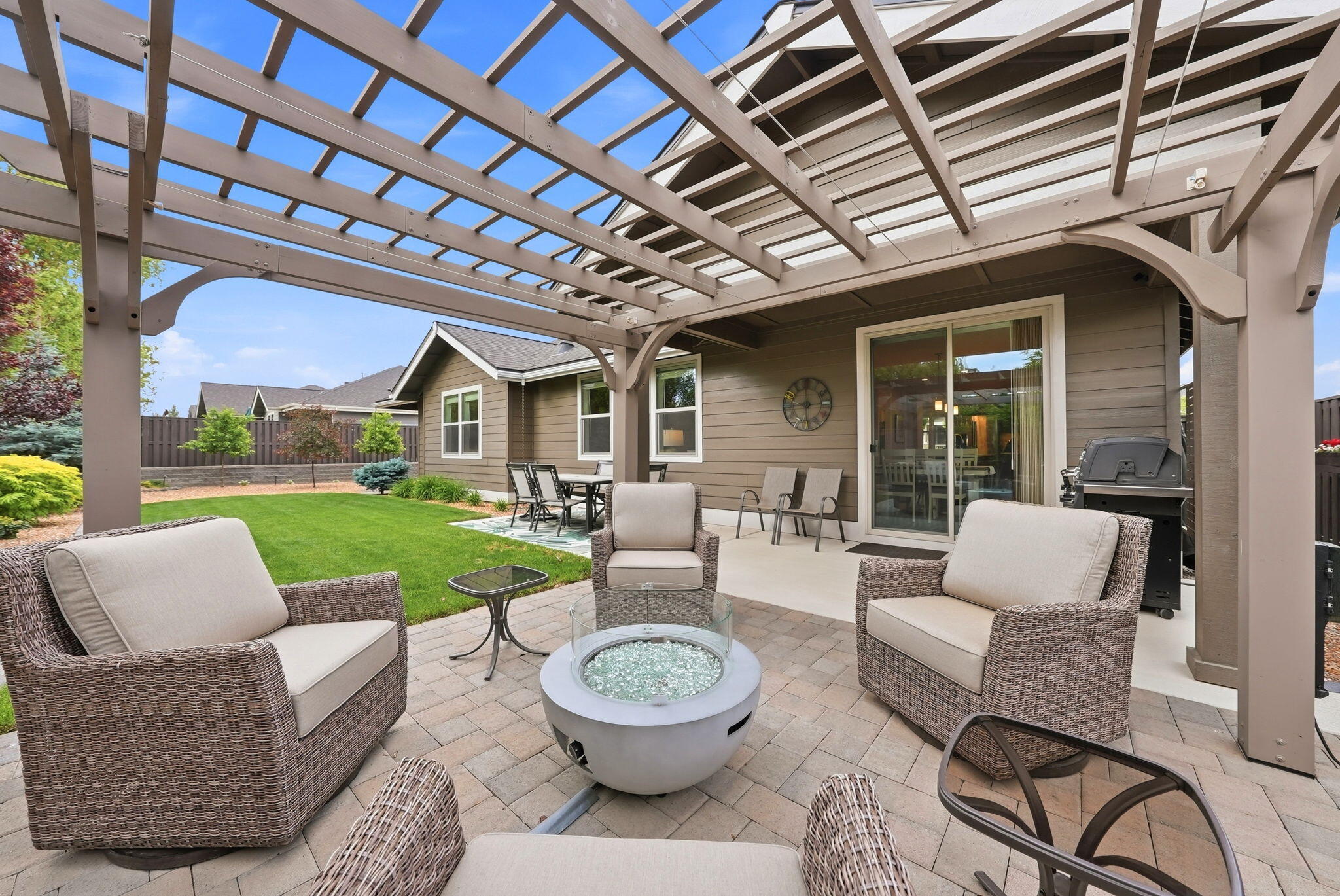 2714 Northwest 23rd Street Redmond, OR 97756 - Photo 39 of 57 a view of a patio with couches chairs and a yard