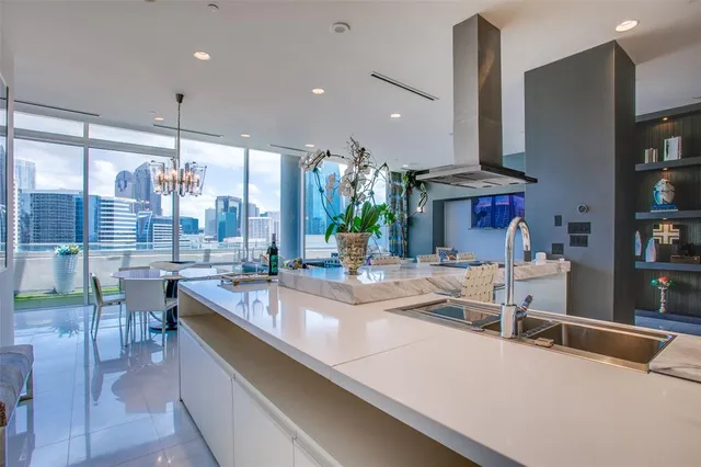 a kitchen with a table chairs and entryway