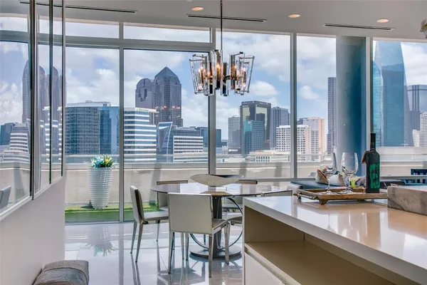 a view of a dining room with furniture and chandelier