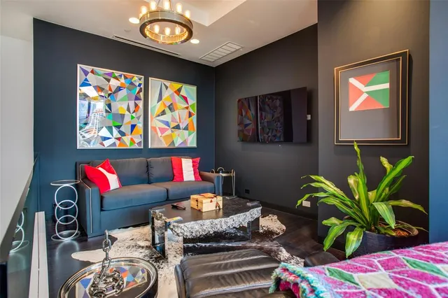 a living room with furniture and a bookshelf