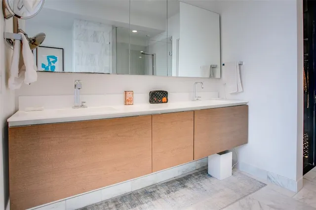 a bathroom with a bathtub and a sink