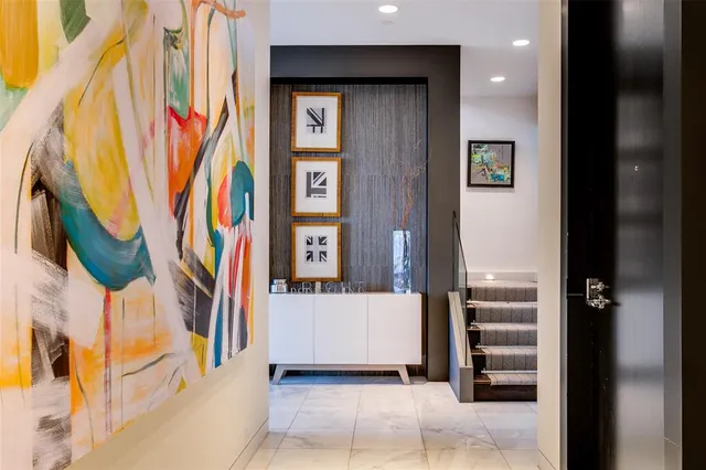 a view of entryway and hall with wooden floor