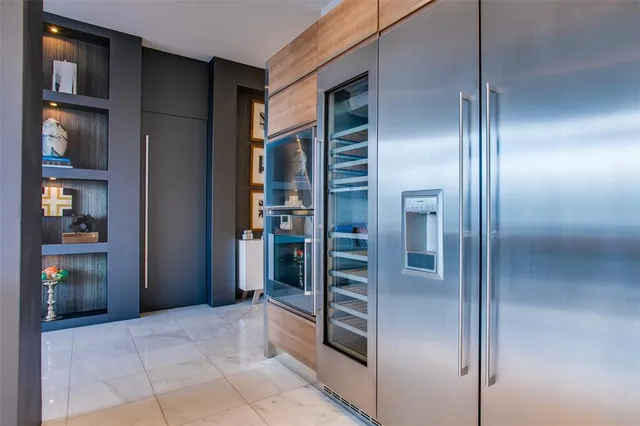 a view of a hallway with wooden shelves
