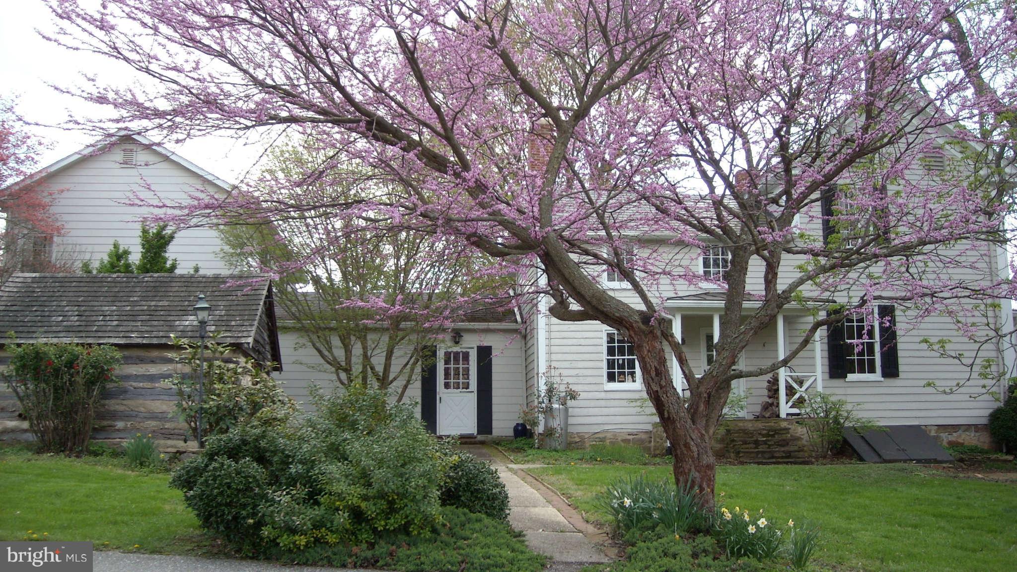 0 Cooper Road Phoenix, MD 21131 - Photo 2 of 30 a front view of a house with a garden and tree