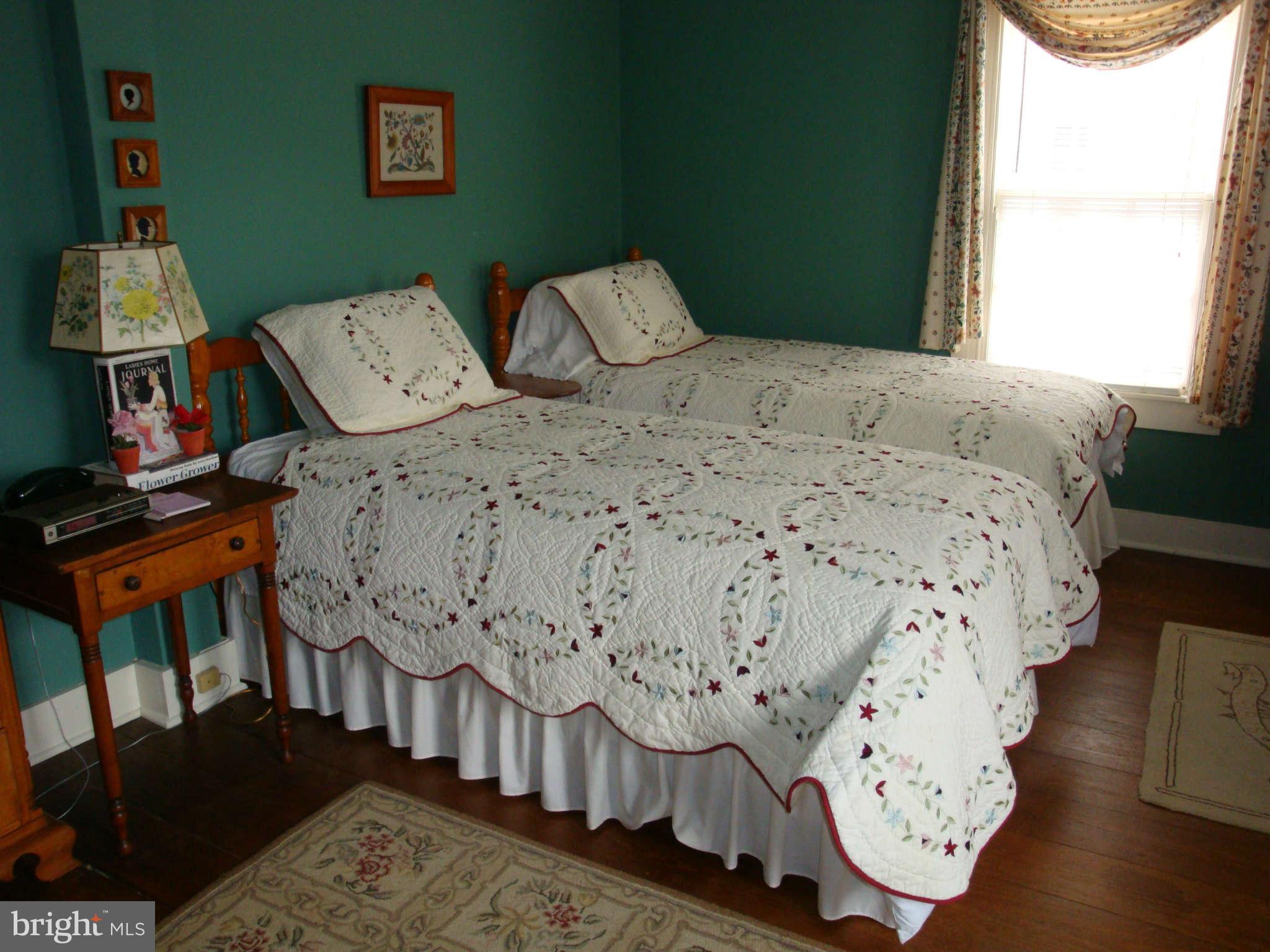 0 Cooper Road Phoenix, MD 21131 - Photo 16 of 30 a bed sitting in a bedroom next to a window
