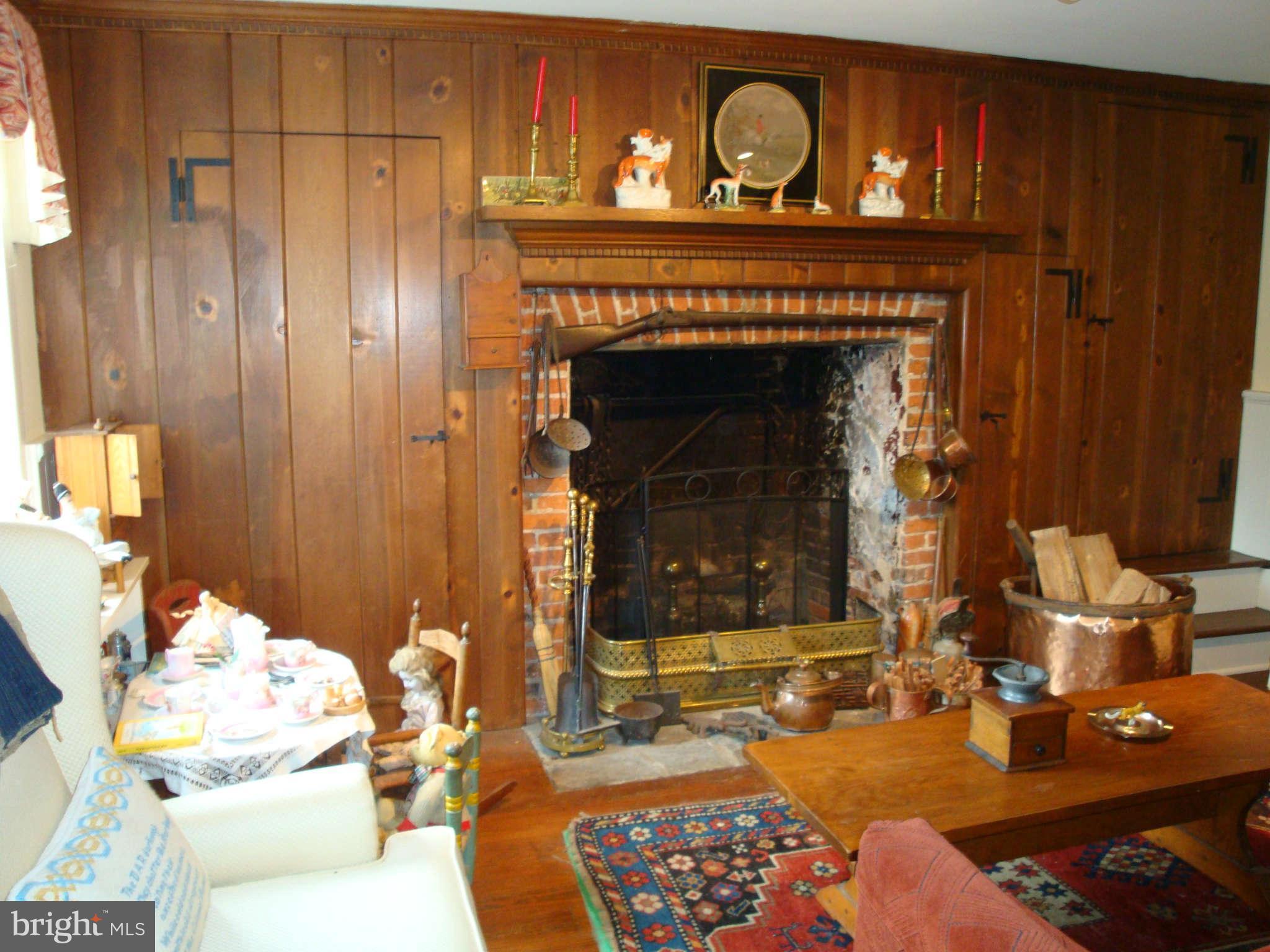 0 Cooper Road Phoenix, MD 21131 - Photo 8 of 30 a living room with furniture a flat screen tv and a fireplace