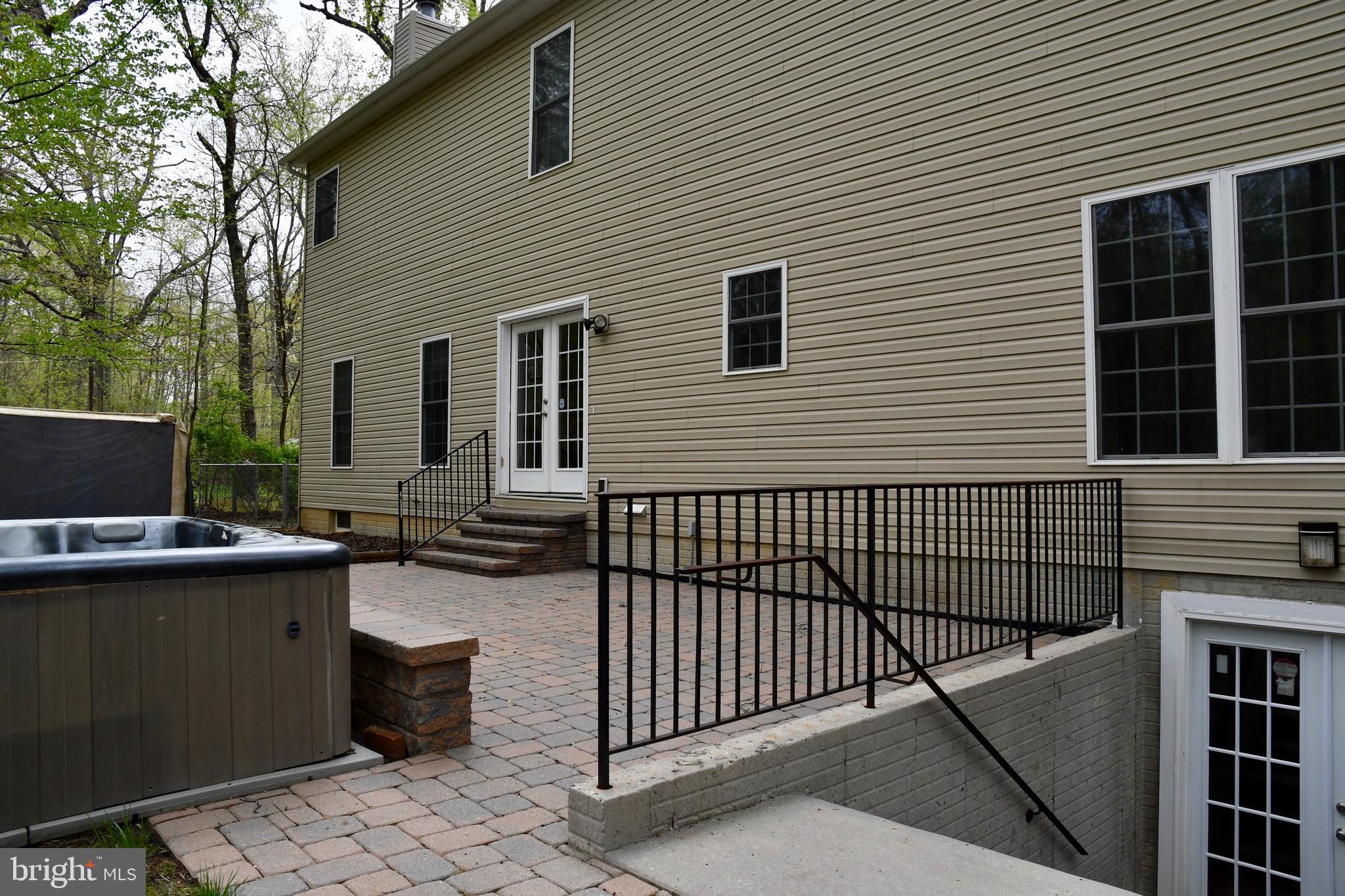 2138 Barrison Point Road Baltimore, MD 21221 - Photo 54 of 64 Back View with Brick Patio & Hot Tub