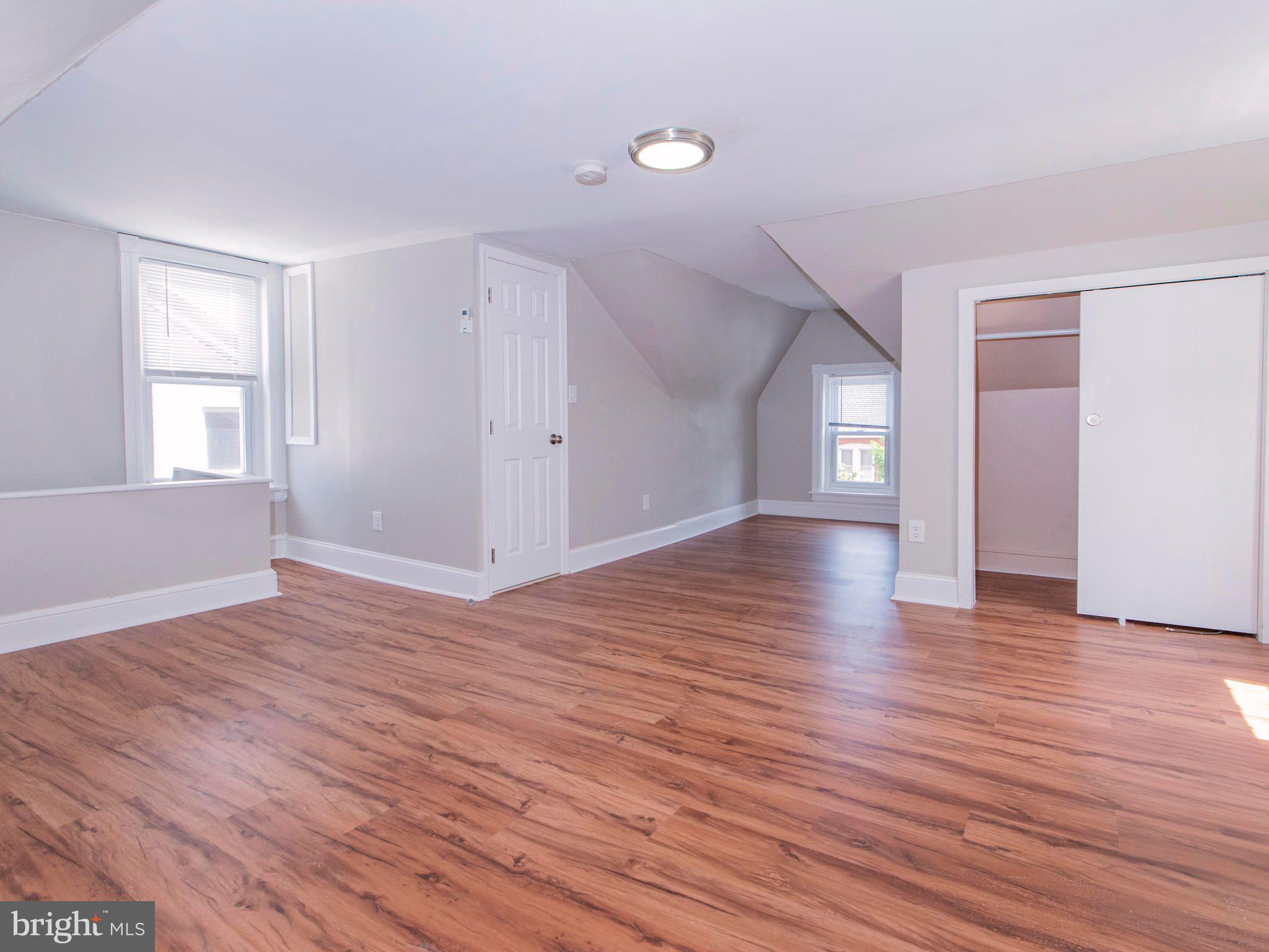 14 West 3rd Street, Unit 2 Pottstown, PA 19464 - Photo 11 of 13 a view of empty room with wooden floor and fan