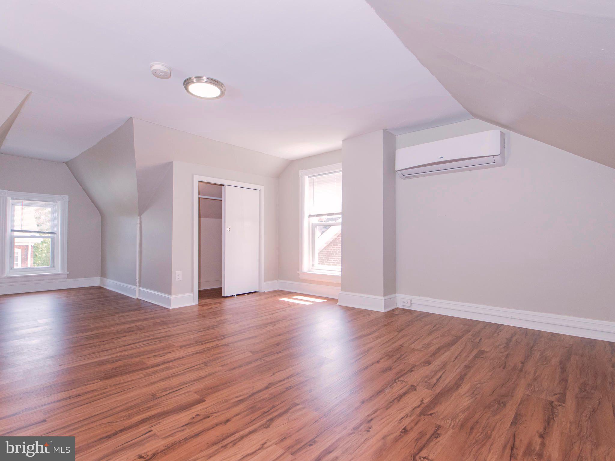 14 West 3rd Street, Unit 2 Pottstown, PA 19464 - Photo 13 of 13 a view of an empty room with wooden floor and window