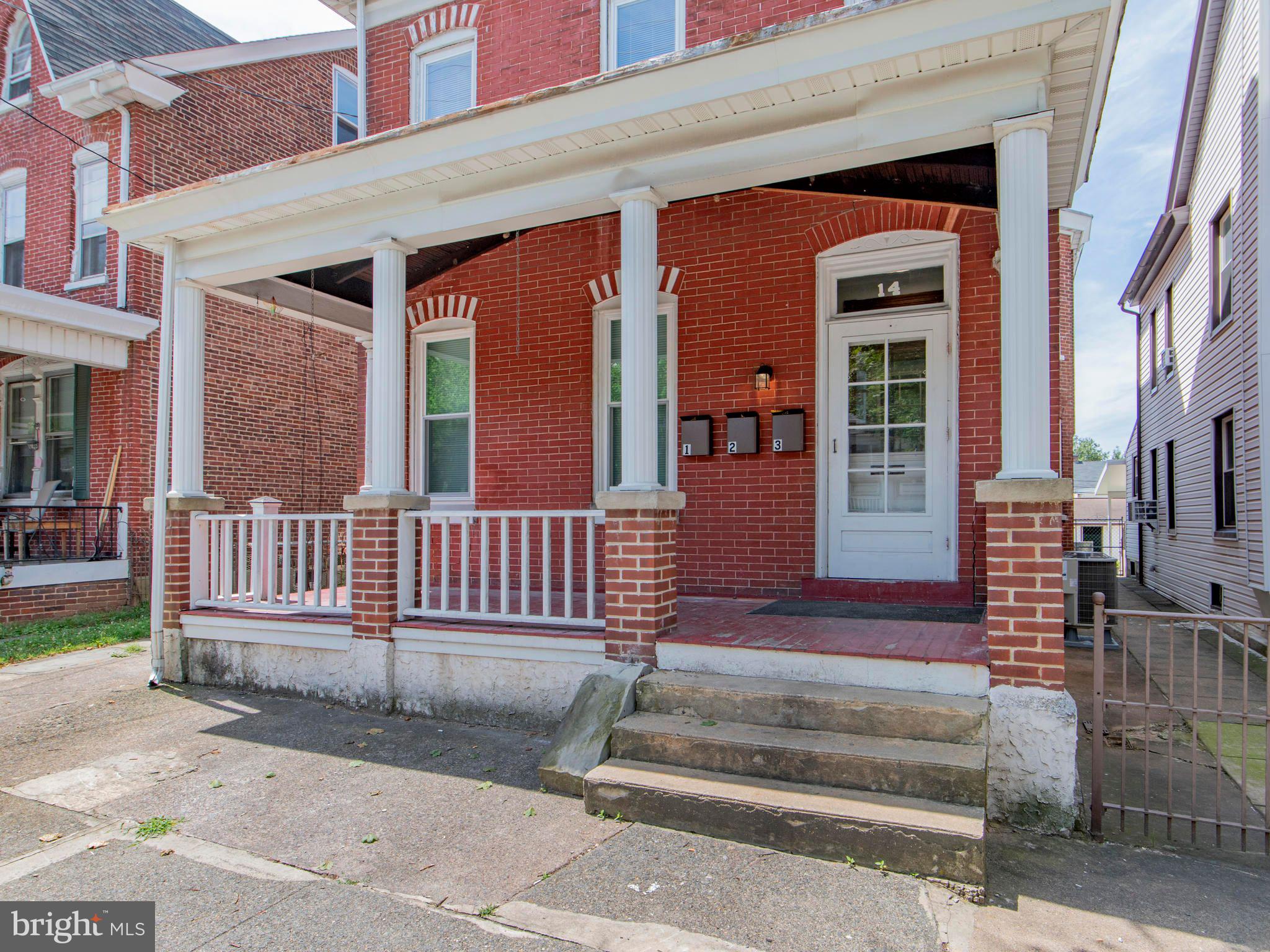 14 West 3rd Street, Unit 2 Pottstown, PA 19464 - Photo 3 of 13 a front view of a house with a porch
