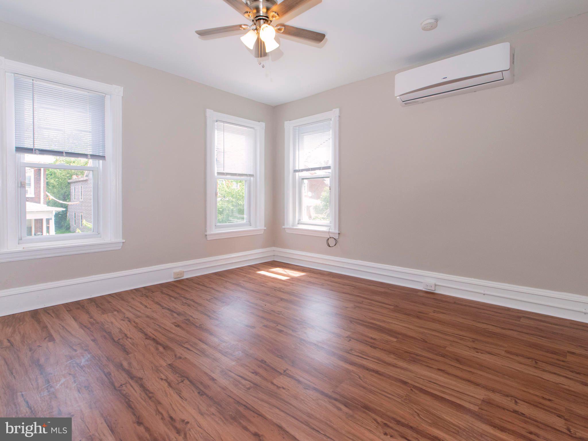 14 West 3rd Street, Unit 2 Pottstown, PA 19464 - Photo 7 of 13 a view of an empty room with wooden floor and a window