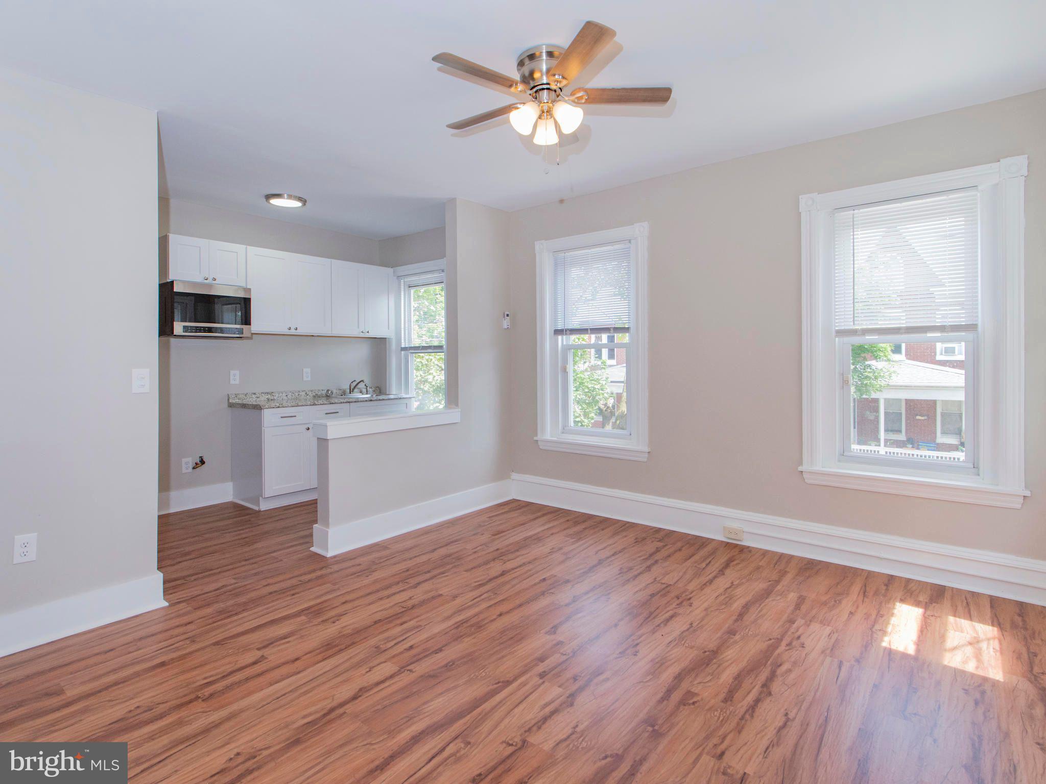14 West 3rd Street, Unit 2 Pottstown, PA 19464 - Photo 8 of 13 a view of a kitchen with wooden floor and a kitchen
