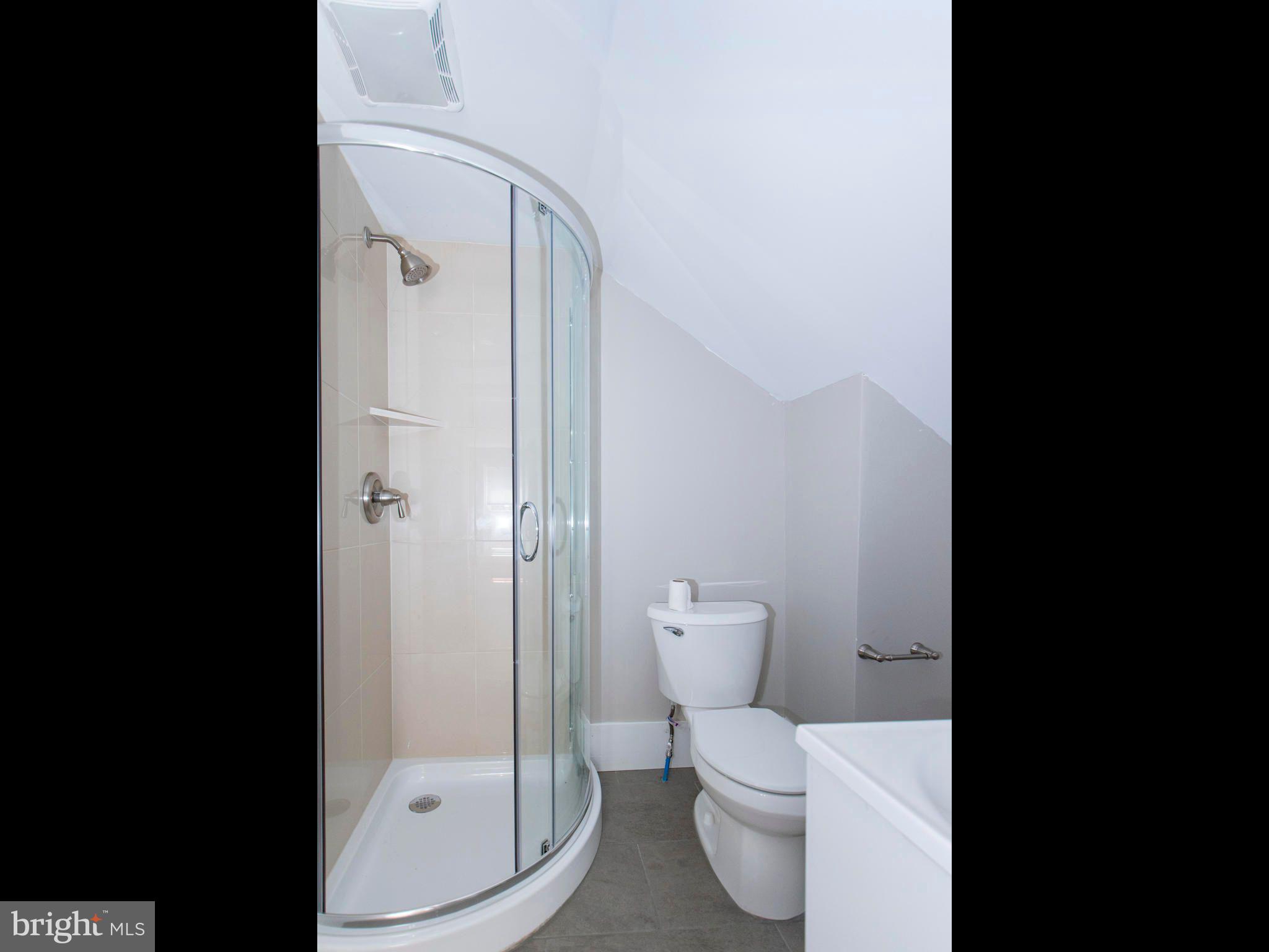 14 West 3rd Street, Unit 2 Pottstown, PA 19464 - Photo 9 of 13 a bathroom with a toilet and a shower