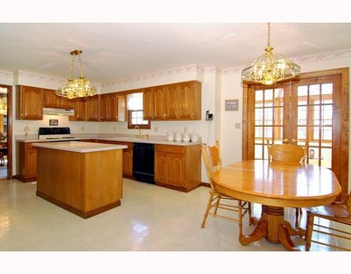 7000 Franklin Road Seven Fields, PA 16046 - Photo 5 of 14 Kitchen. Expansive sun-filled kitchen with an abundance of oak cabinetry, neutral counter-tops, large center island and attractive light fixtures.