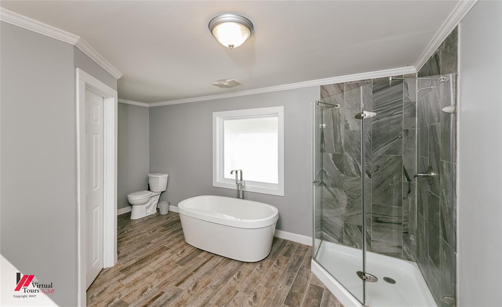 12507 Highway 159 Shongaloo, LA 71072 - Photo 18 of 35 a bath room with a toilet and a shower