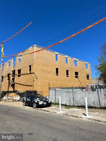 a view of a car is parked in front of a house