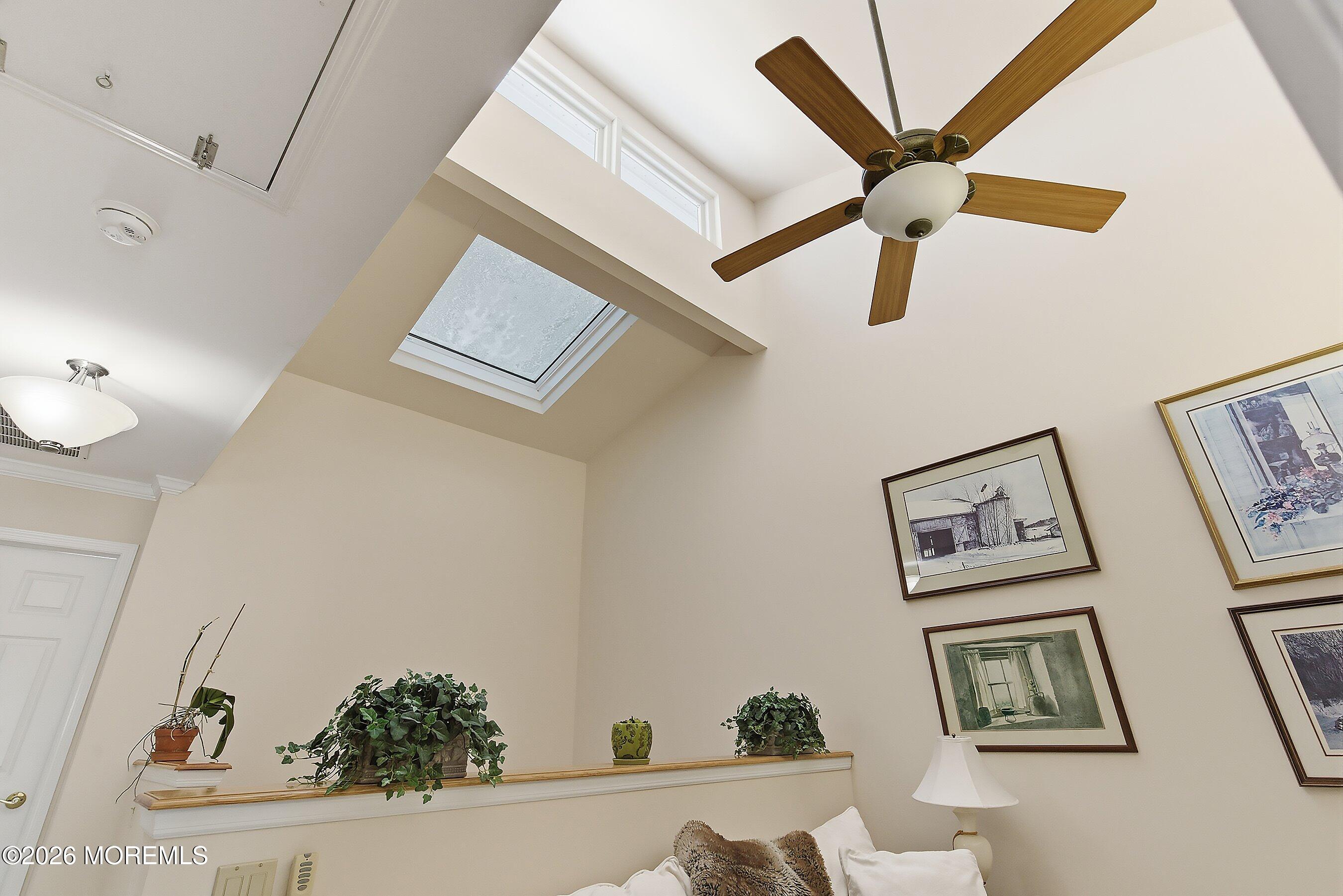 29 Rambling Meadow Court Tinton Falls, NJ 07724 - Photo 19 of 29 a view of a hallway with paintings on the wall