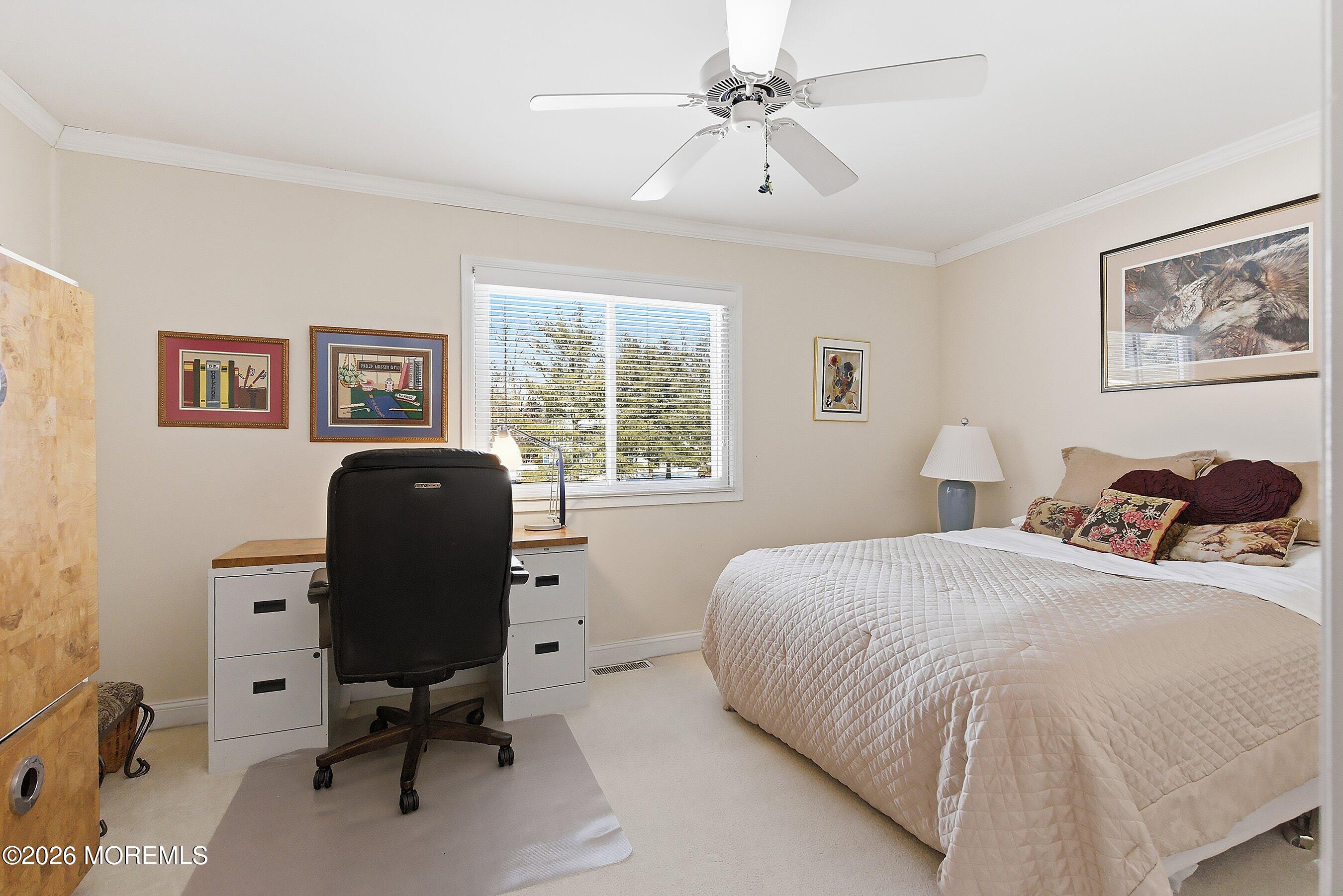 29 Rambling Meadow Court Tinton Falls, NJ 07724 - Photo 25 of 29 a bedroom with a bed and a desk