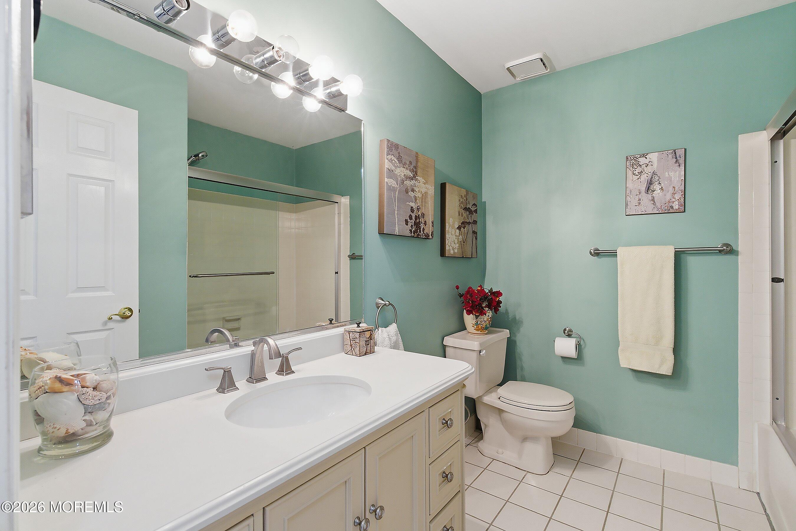 29 Rambling Meadow Court Tinton Falls, NJ 07724 - Photo 26 of 29 a bathroom with a sink vanity mirror and toilet