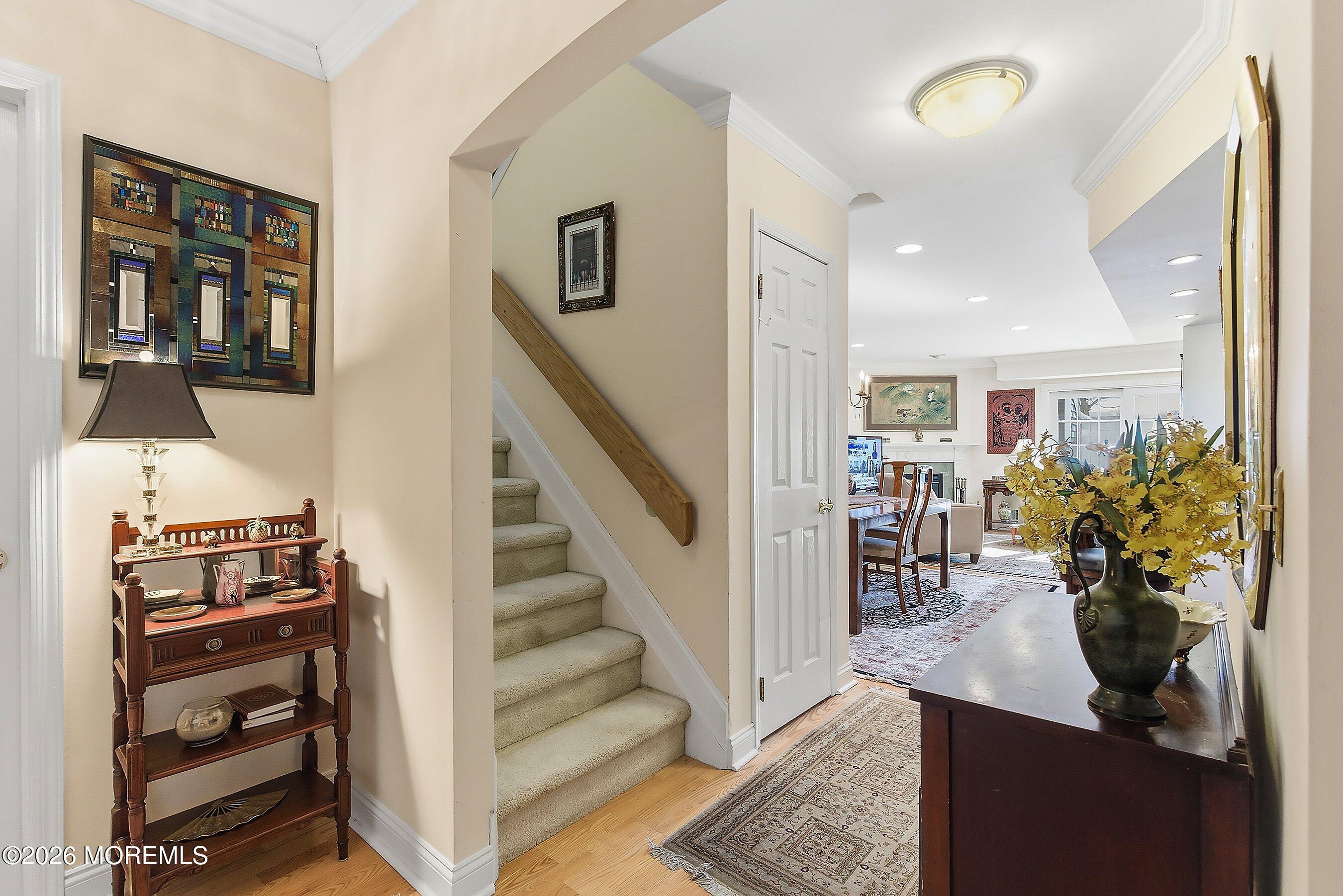 29 Rambling Meadow Court Tinton Falls, NJ 07724 - Photo 6 of 29 a view of a hallway with furniture and a potted plant
