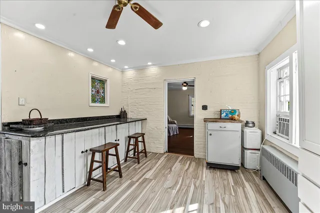 a kitchen with refrigerator and sink