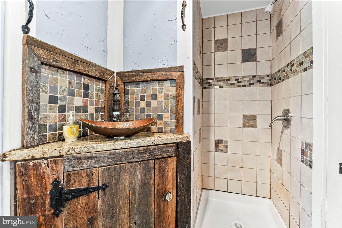 990 Chesterville Road Oxford, PA 19363 - Photo 16 of 47 a bathroom with a sink and a shower