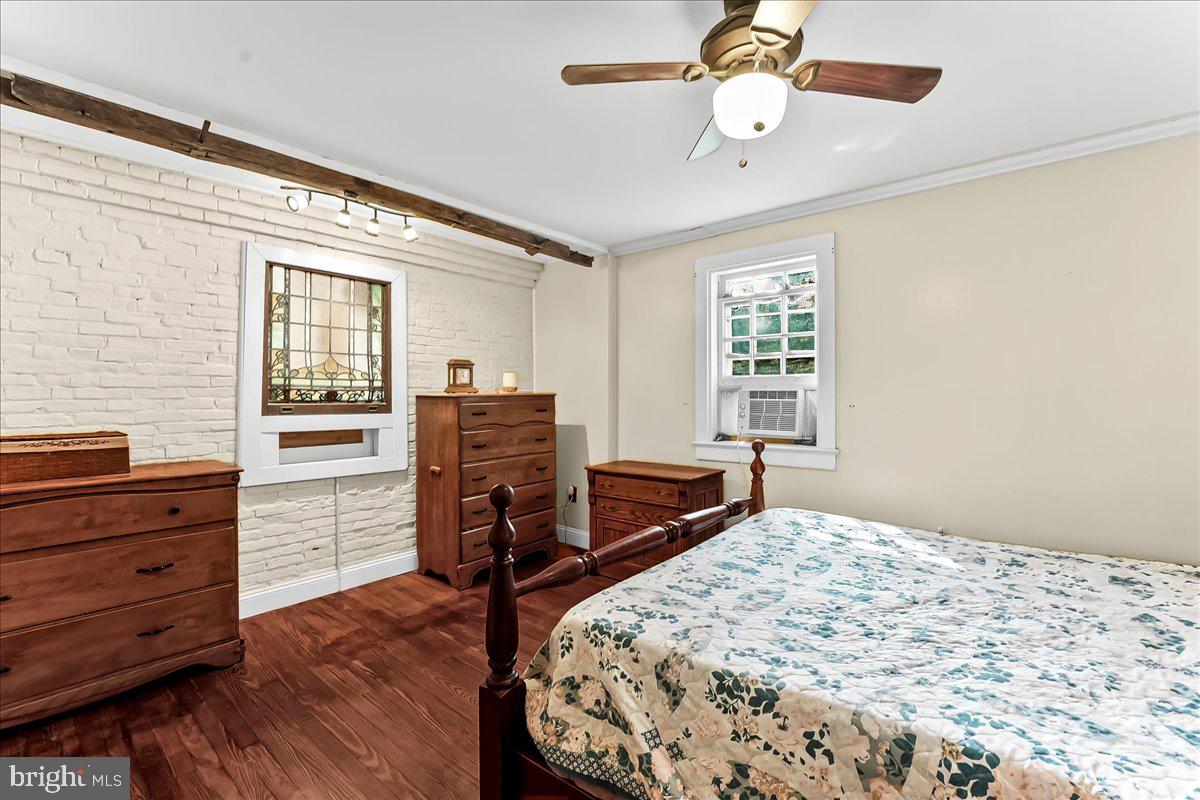 990 Chesterville Road Oxford, PA 19363 - Photo 21 of 47 a bedroom with a bed and wooden floor