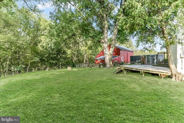 a view of a house with a yard porch and sitting area