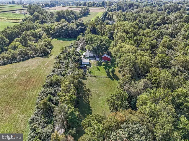 a view of a table and chairs in the garden